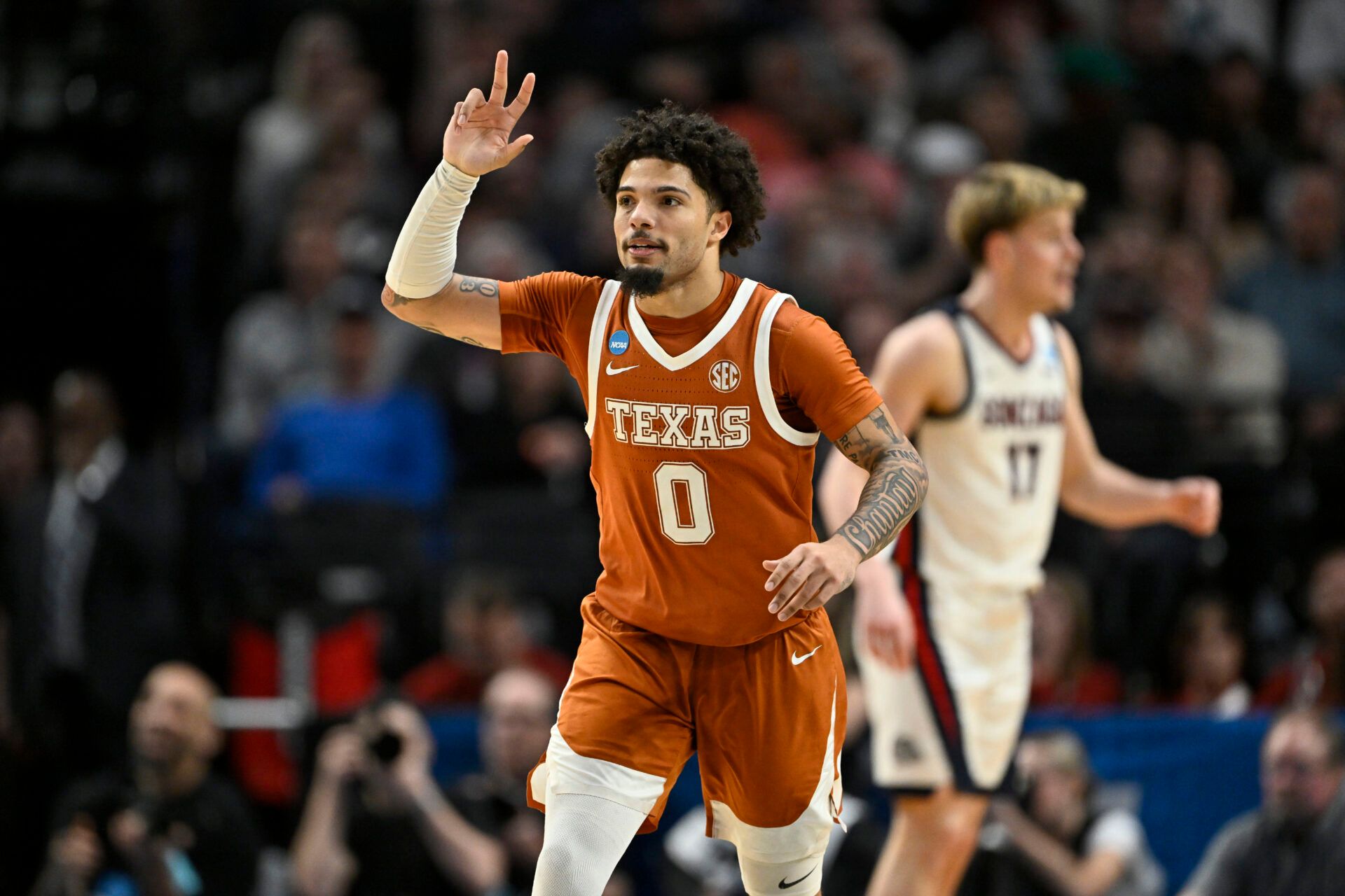 Texas Longhorns guard Jordan Pope (0) reacts after a basket in the second half against the Gonzaga Bulldogs during a second round game of the men's 2026 NCAA Tournament at Moda Center.