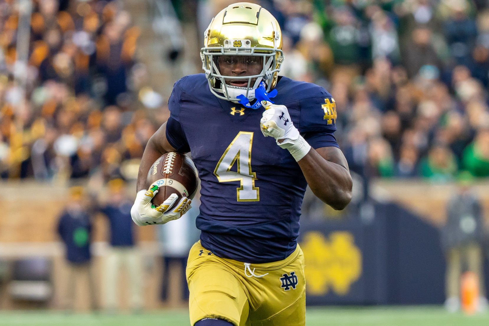 Notre Dame Fighting Irish running back Jeremiyah Love (4) runs the ball against the Syracuse Orange during the first half at Notre Dame Stadium.