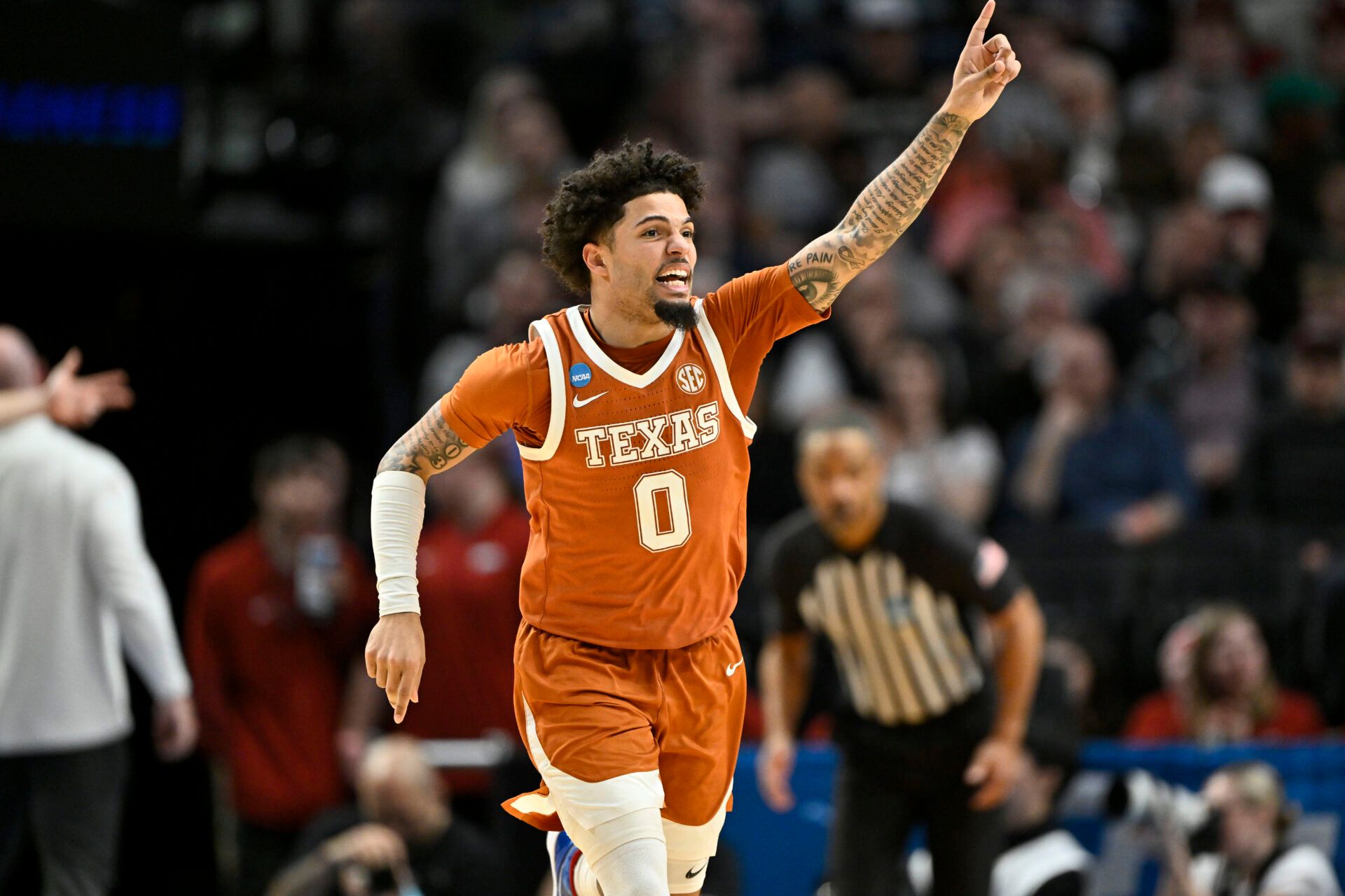 Texas Longhorns guard Jordan Pope (0) reacts after a basket in the second half against the Gonzaga Bulldogs during a second round game of the men's 2026 NCAA Tournament at Moda Center.