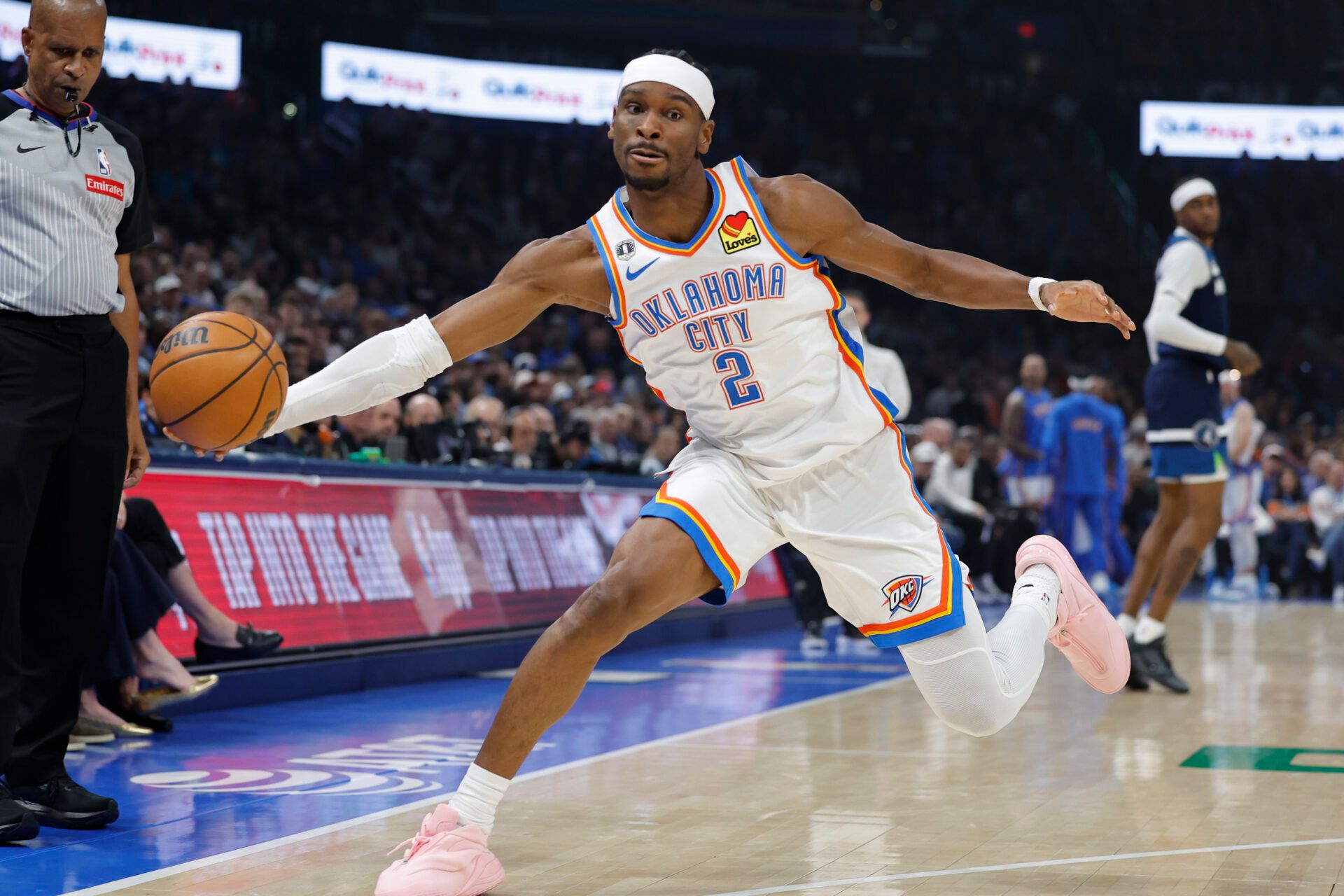 Oklahoma City Thunder guard Shai Gilgeous-Alexander (2) reaches to save the ball from going out of bounds on a play against the Minnesota Timberwolves during the first half at Paycom Center.