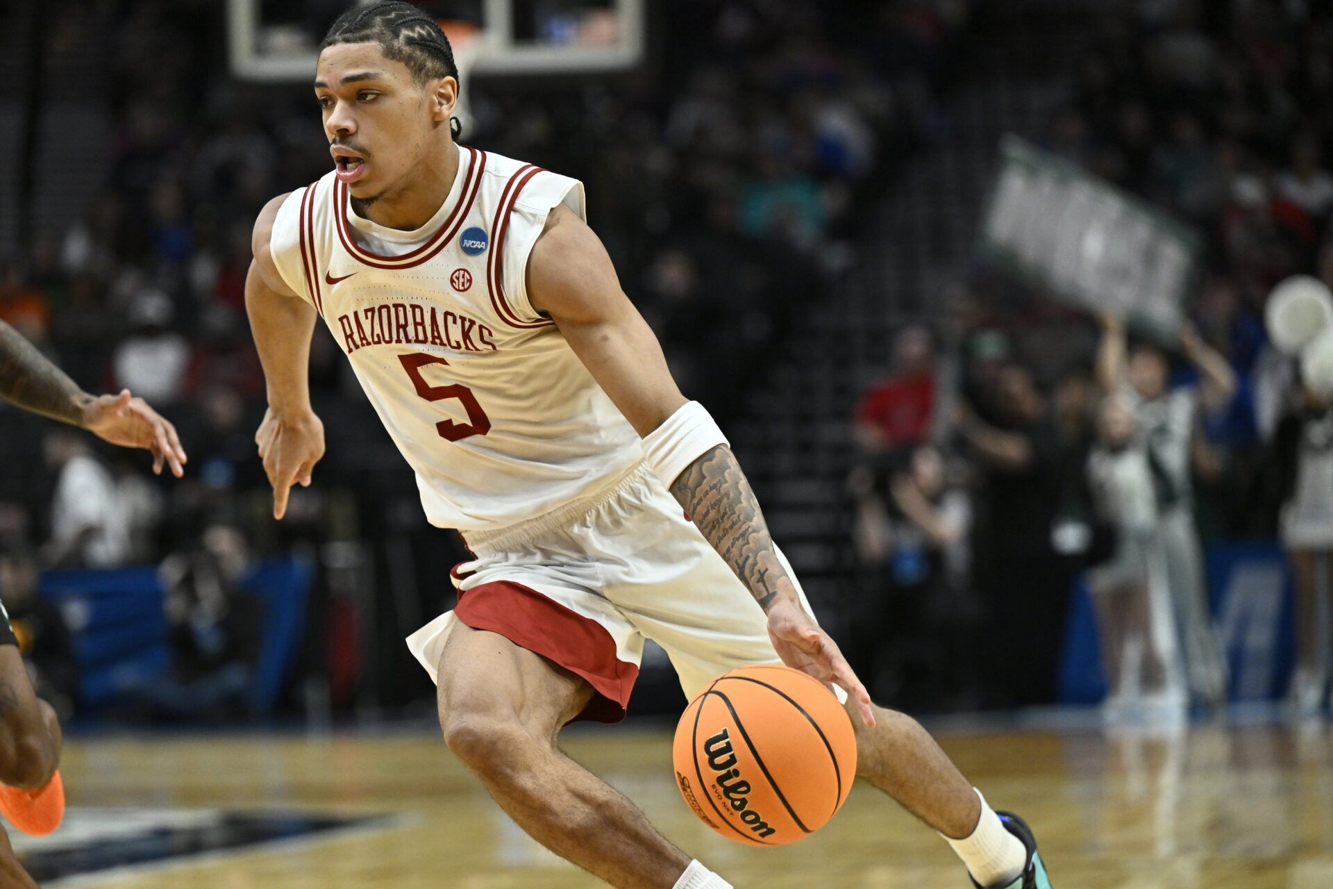 Arkansas Razorbacks guard Darius Acuff Jr. (5) drives against the Hawaii Rainbow Warriors in the second half during a first round game of the men's 2026 NCAA Tournament at Moda Center.