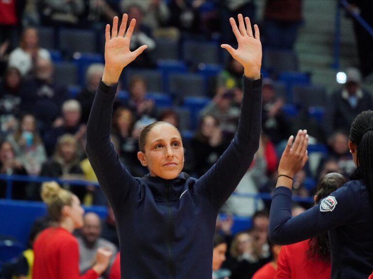 2020 USA Womens National Team guard Diana Taurasi (12) waves to the crown as she in introduced before the game against the UConn Huskies at XL Center.