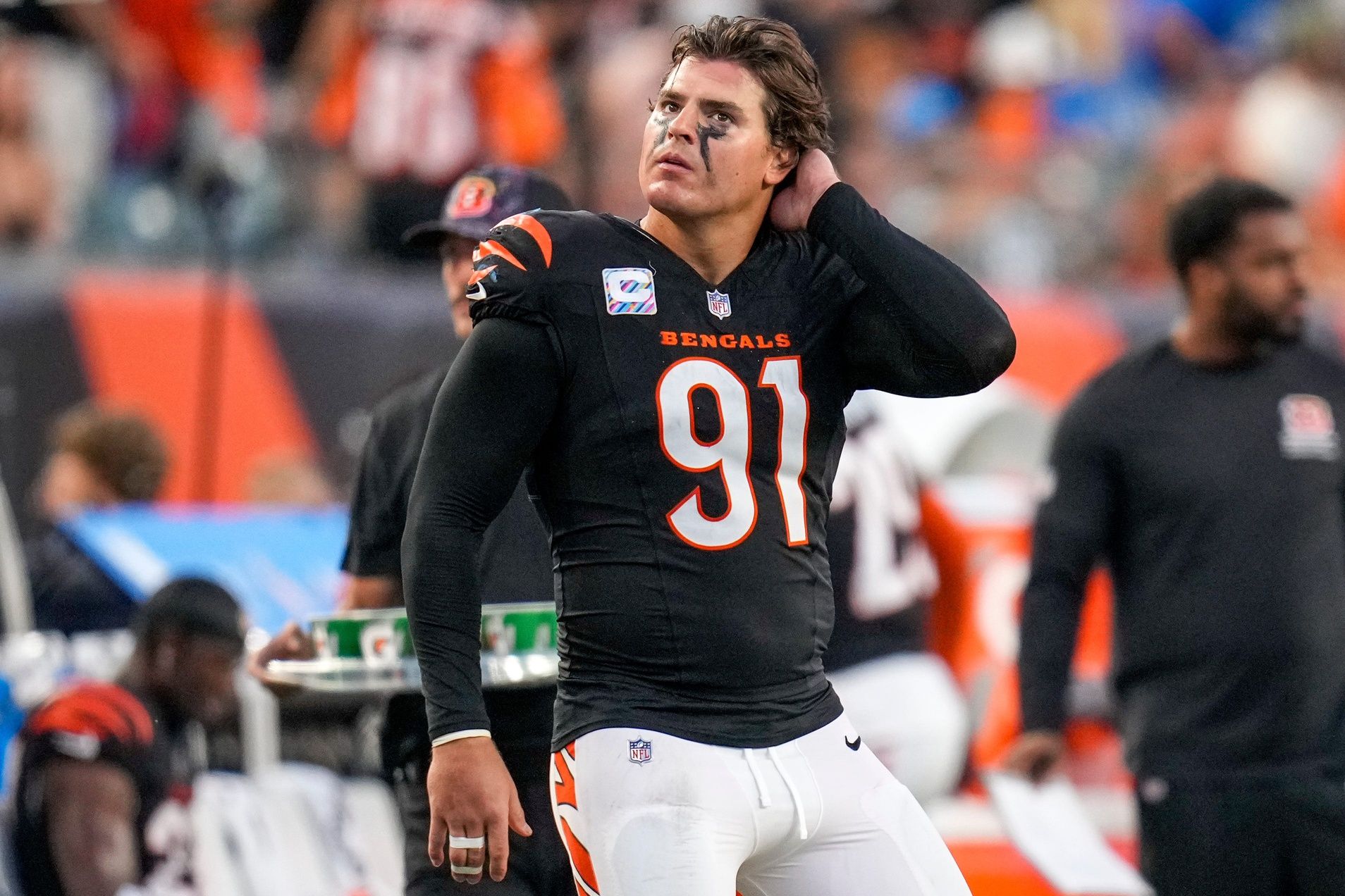 Cincinnati Bengals defensive end Trey Hendrickson (91) watches a replay as the Detroit Lions celebrate a touchdown in the fourth quarter of the NFL Week 5 game between the Cincinnati Bengals and the Detroit Lions at Paycor Stadium in downtown Cincinnati on Sunday, Oct. 5, 2025. The Bengals continued a losing streak, falling 37-24 to the Lions.