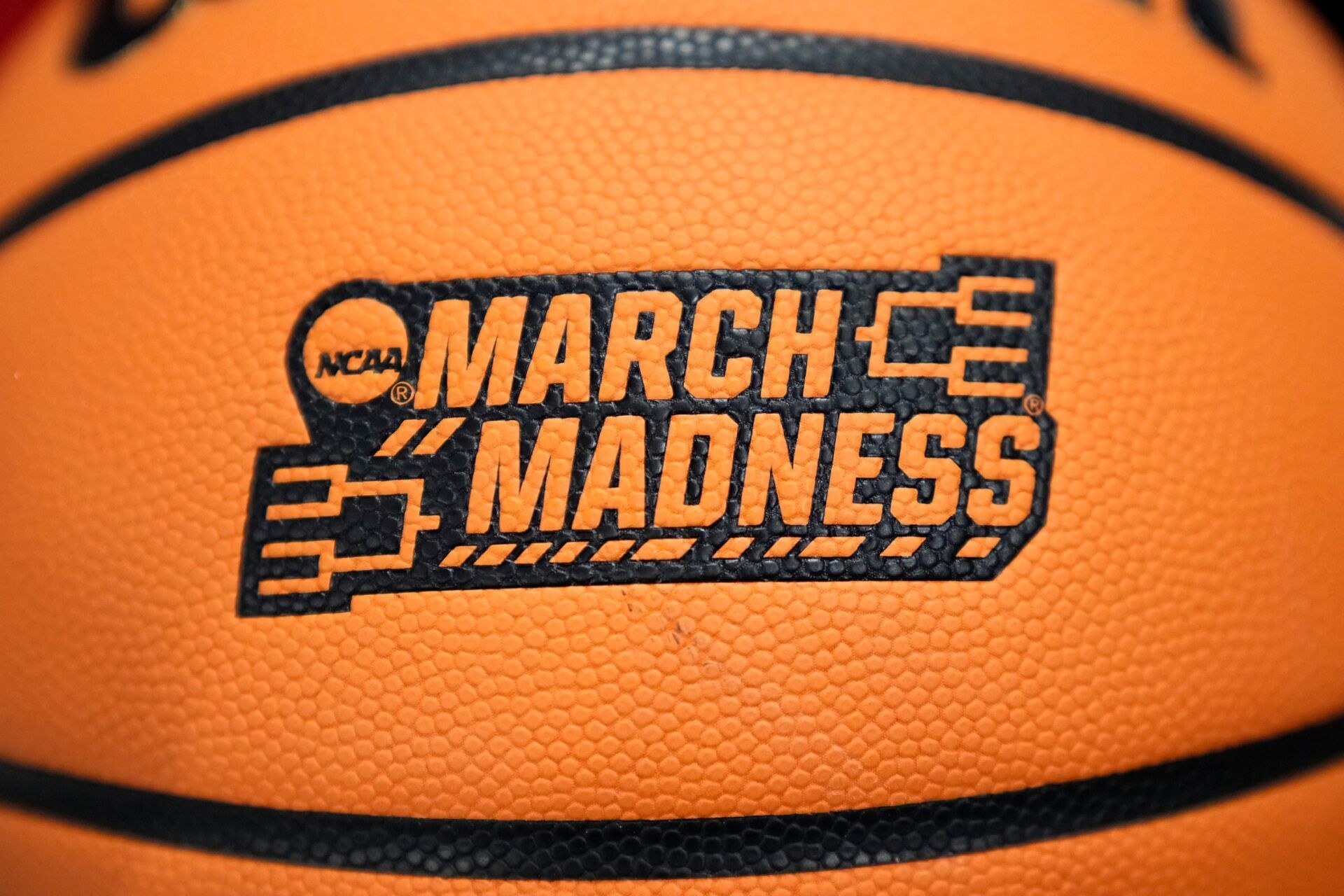 A March Madness basketball sits courtside during the NCAA women's basketball tournament second round game between the Notre Dame Fighting Irish and the Ohio State Buckeyes at the Jerome Schottenstein Center in Columbus on March 23, 2026. Notre Dame won 83-73.