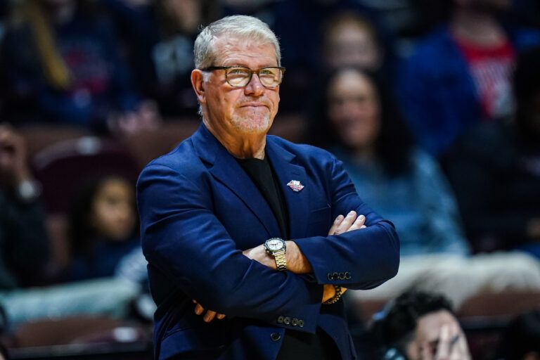 UConn Huskies head coach Geno Auriemma watches from the sideline as they take on the Creighton Bluejays at Mohegan Sun Arena.