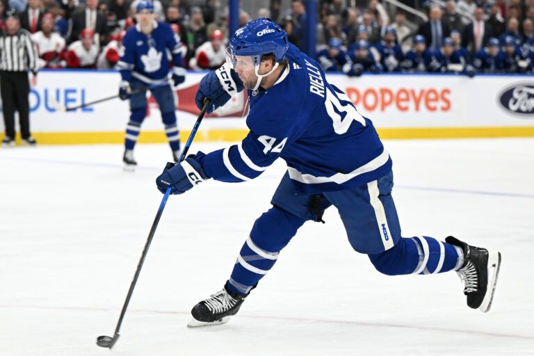 Toronto Maple Leafs defenseman Morgan Rielly (44) hits a slapshot against the Carolina Hurricanes in the first period at Scotiabank Arena.