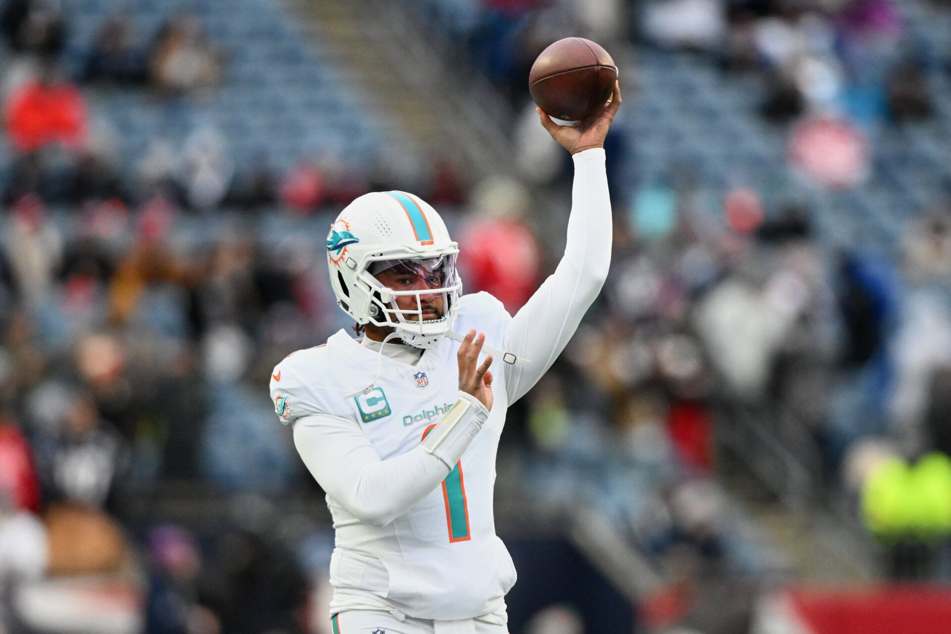 Miami Dolphins quarterback Tua Tagovailoa (1) throws a pass before the game against the New England Patriots at Gillette Stadium.