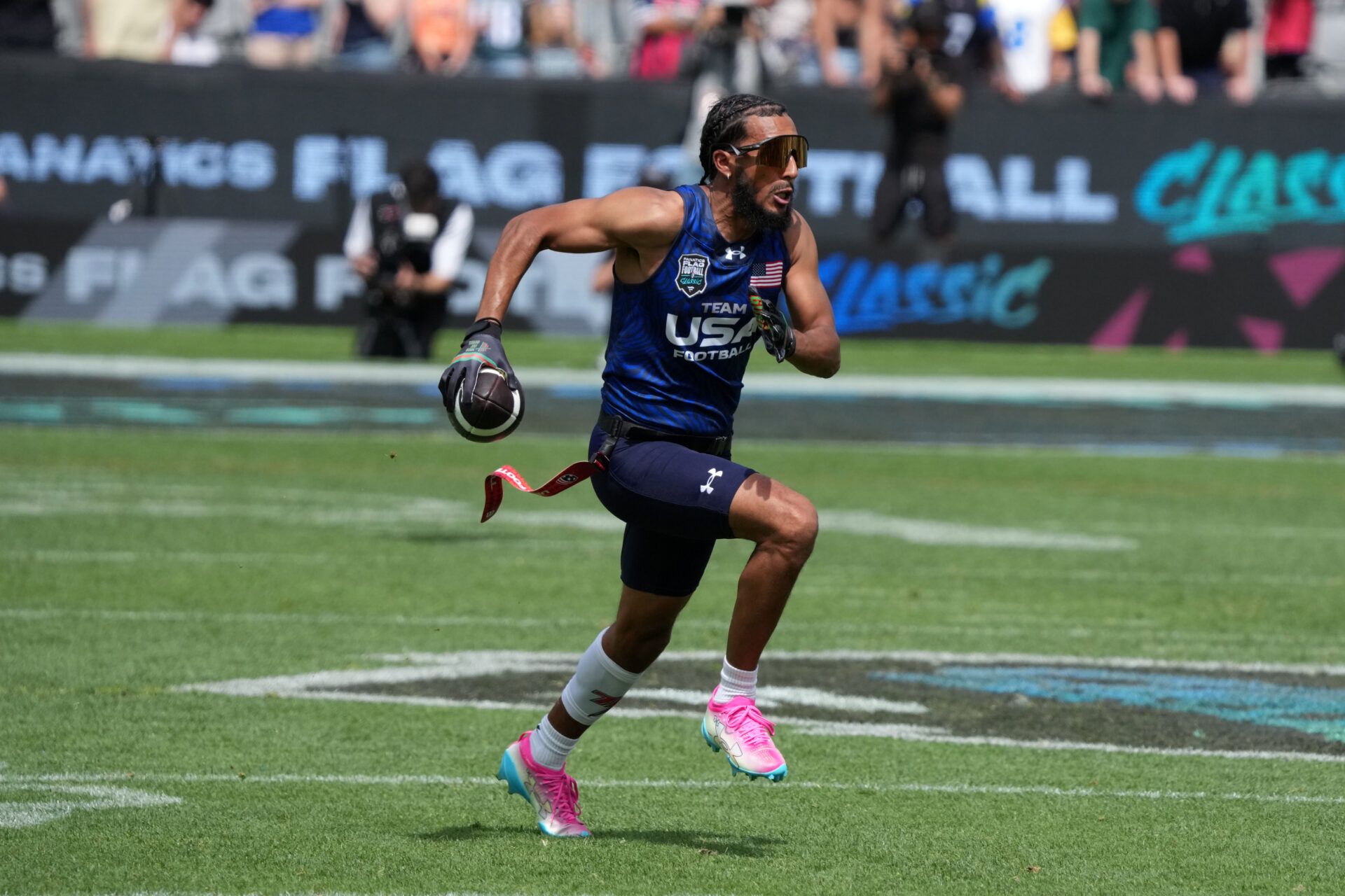 Team USA quarterback Darrell Doucette III (Housh Doucette III) carries the ball during the Fanatics Flag Football Classic at BMO stadium.
