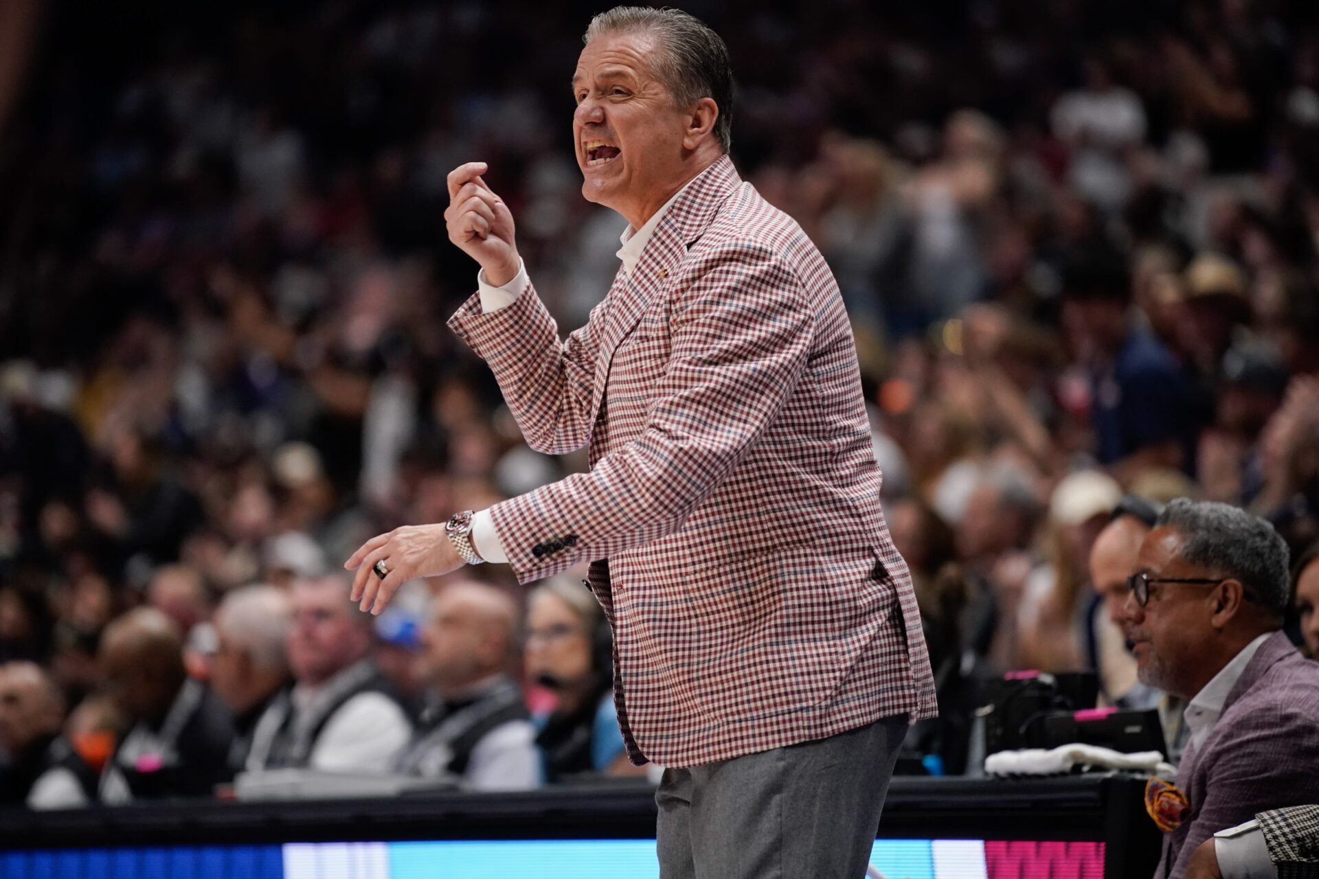 Arkansas coach John Calipari calls to players during the first half of the SEC tournament championship game against Vanderbilt at Bridgestone Arena in Nashville, Tenn., Sunday, March 15, 2026.