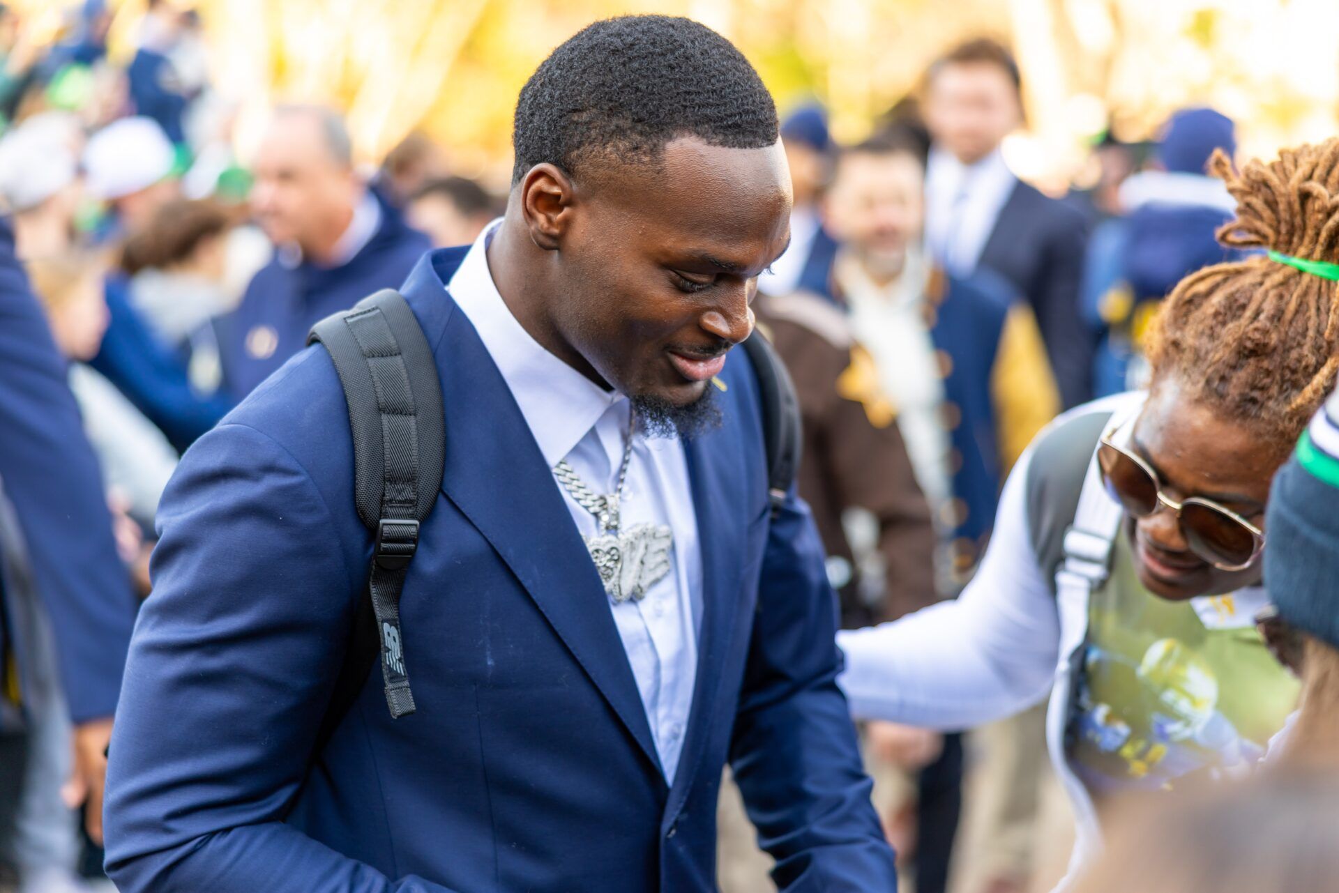 Notre Dame Fighting Irish running back Jeremiyah Love greets fans while walking to the stadium before facing the Syracuse Orange at Notre Dame Stadium.