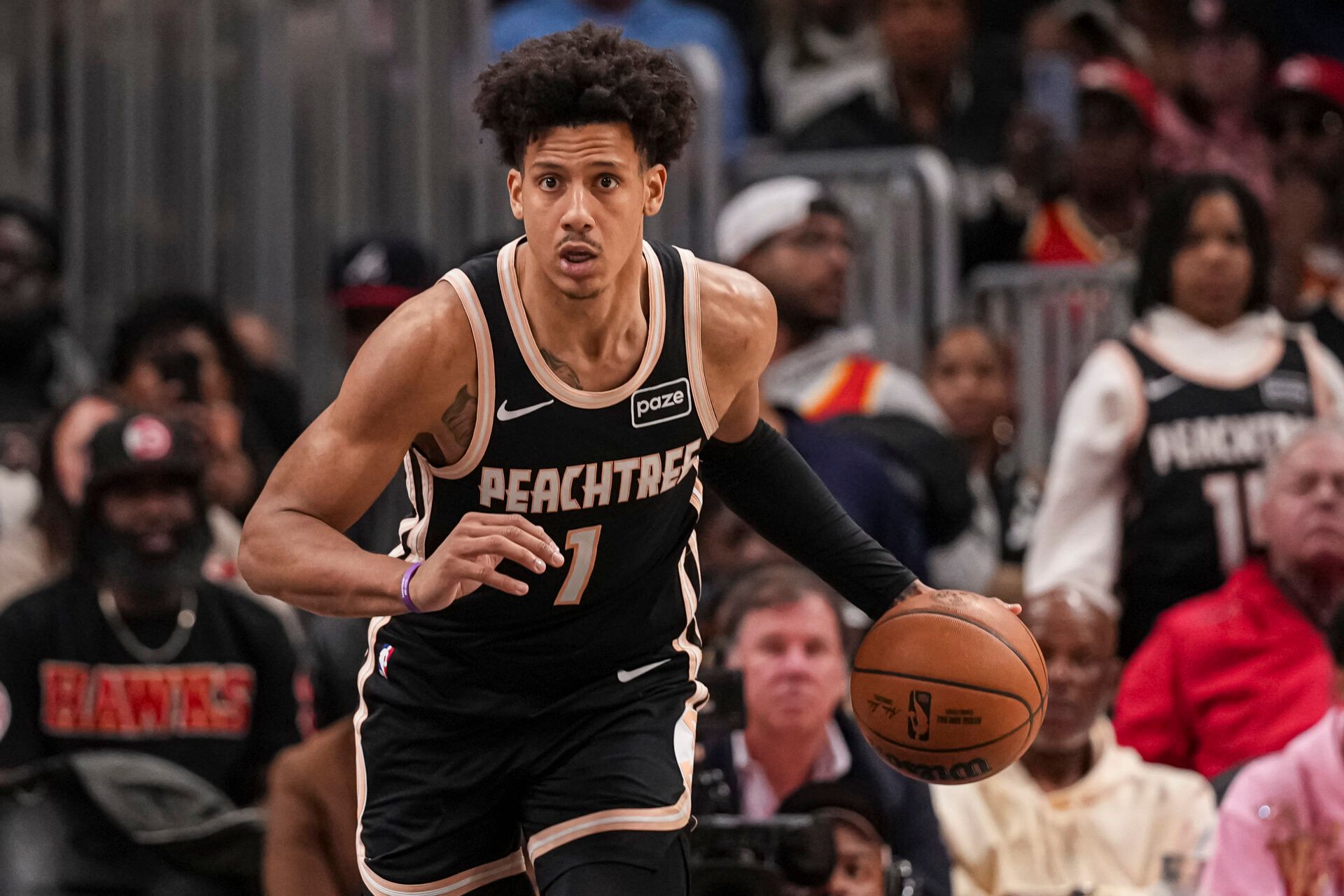 Atlanta Hawks forward Jalen Johnson (1) brings the ball up the floor against the Orlando Magic during the second half at State Farm Arena.