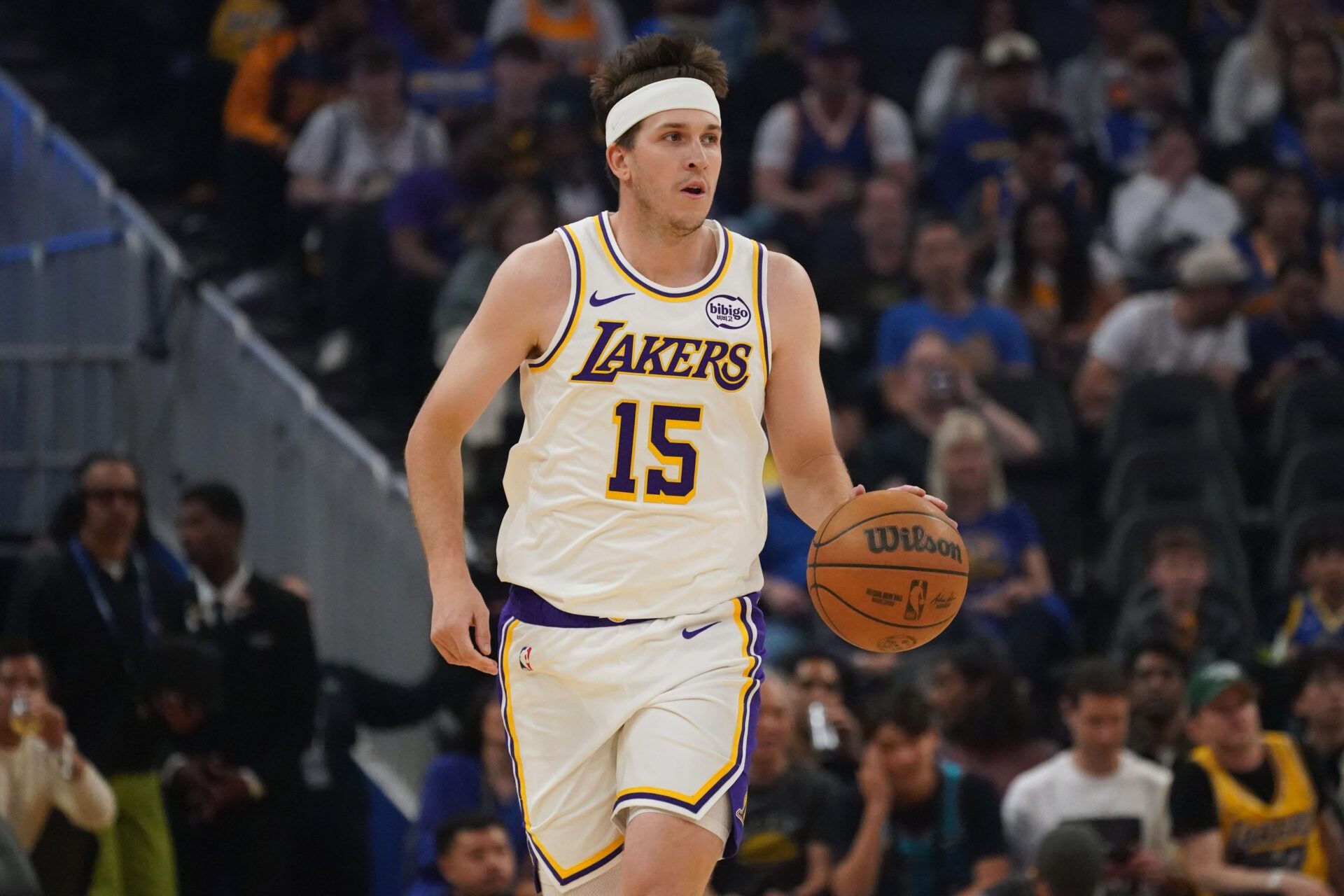 Los Angeles Lakers guard Austin Reaves (15) dribbles upcourt against the Golden State Warriors in the first quarter at Chase Center.