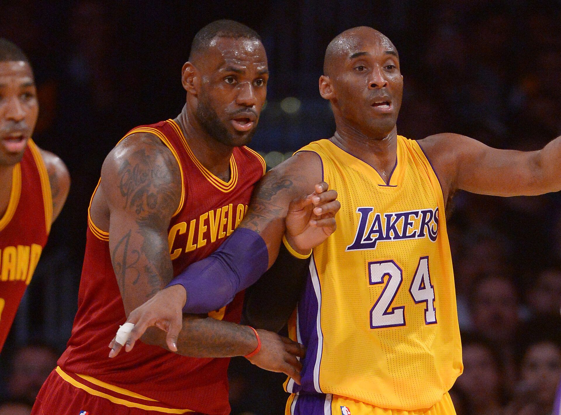 Cleveland Cavaliers forward LeBron James (23) and Los Angeles Lakers forward Kobe Bryant (24) battle for position in the first quarter of the game at Staples Center.