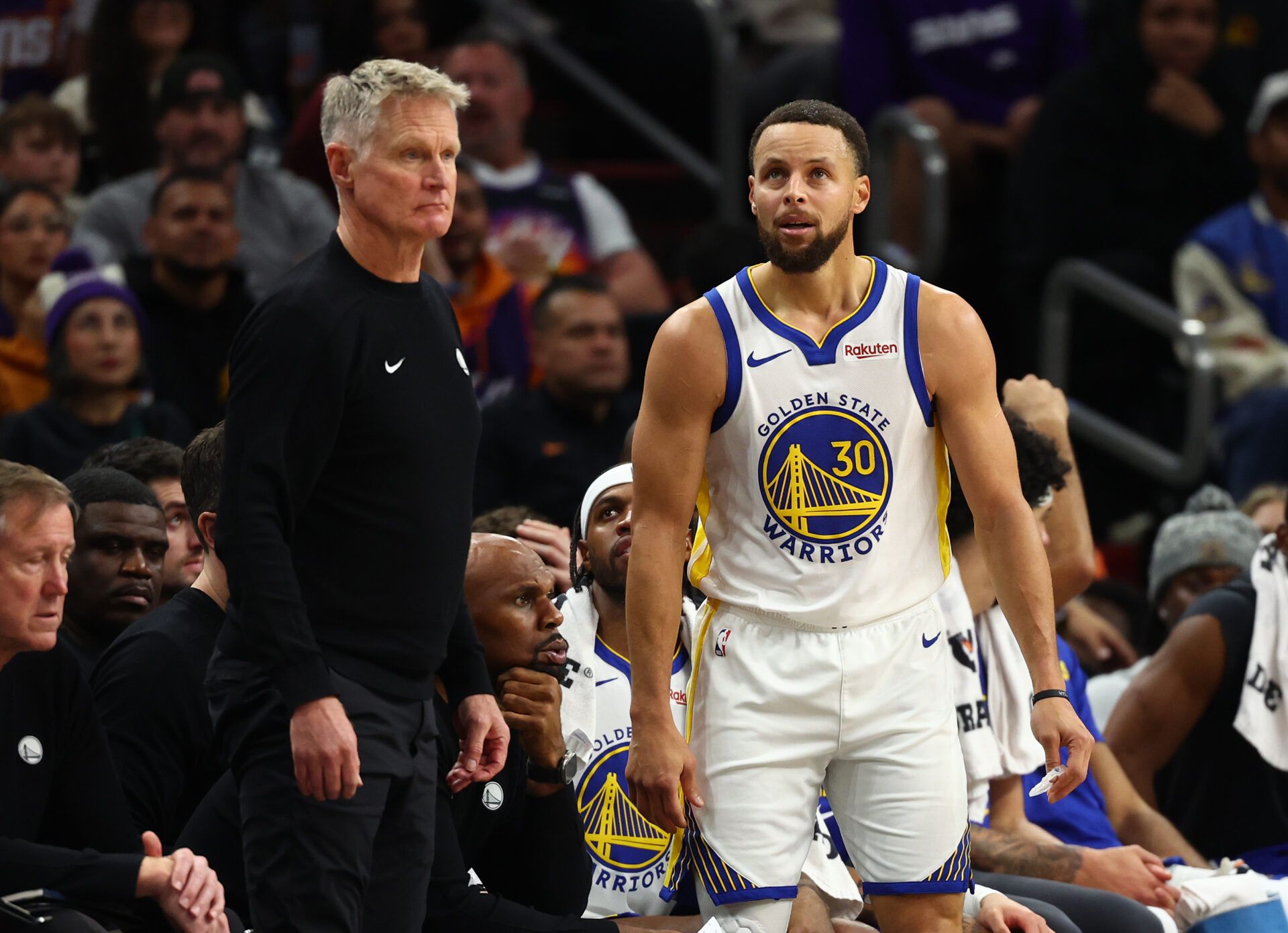 Golden State Warriors guard Stephen Curry (30) reacts alongside head coach Steve Kerr against the Phoenix Suns in the second half at Mortgage Matchup Center.