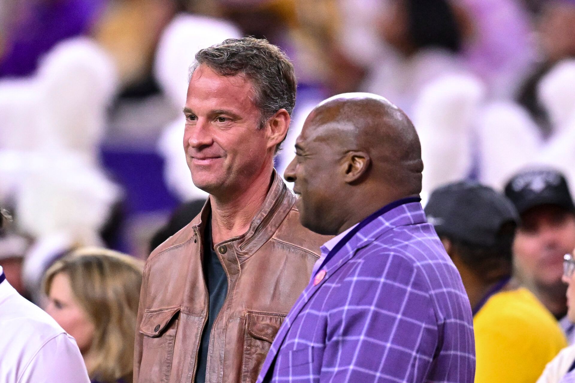 Louisiana State Tigers head coach Lane Kiffin, left, stands next to Louisiana State Tigers athletic director Verge Ausberry, right, prior to the game against the Houston Cougars at NRG Stadium.