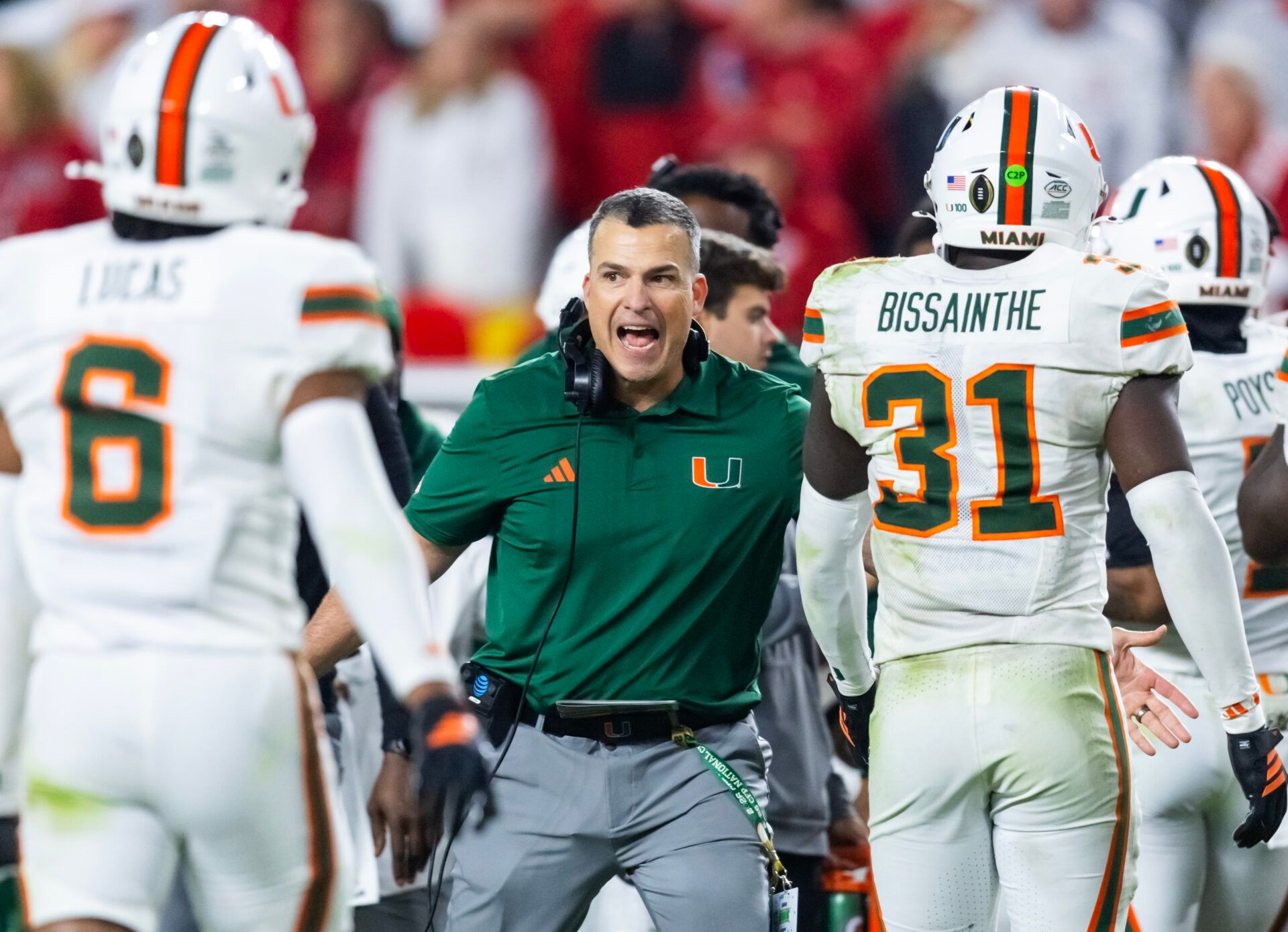 Miami Hurricanes head coach Mario Cristobal with linebacker Wesley Bissainthe (31) against the Indiana Hoosiers during the College Football Playoff National Championship game at Hard Rock Stadium.