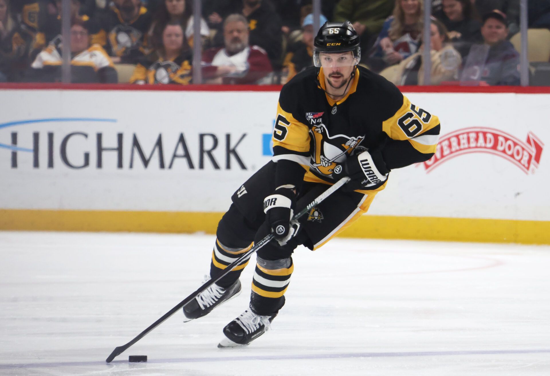 Pittsburgh Penguins defenseman Erik Karlsson (65) skates with the puck against the Colorado Avalanche during the third period at PPG Paints Arena.