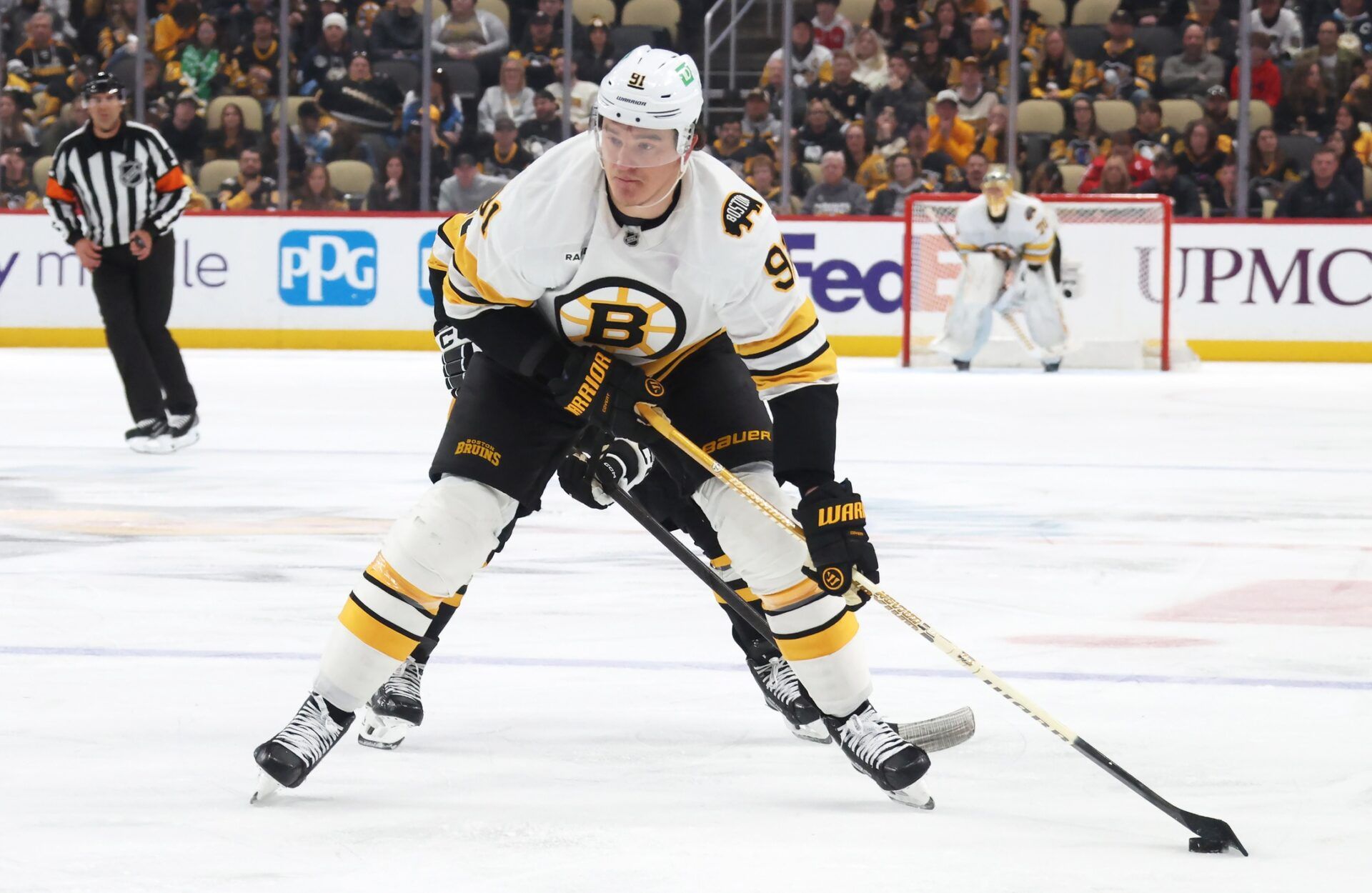 Boston Bruins defenseman Nikita Zadorov (91) skates with the puck against the Pittsburgh Penguins during the third period at PPG Paints Arena.