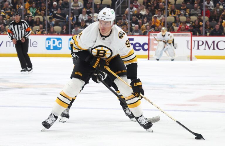Boston Bruins defenseman Nikita Zadorov (91) skates with the puck against the Pittsburgh Penguins during the third period at PPG Paints Arena.