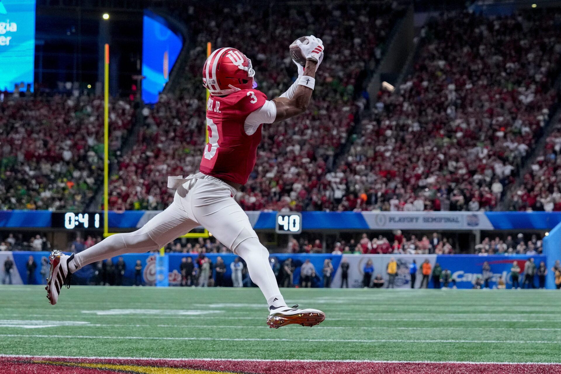 Indiana Hoosiers wide receiver Omar Cooper Jr. (3) makes a catch for a touchdown Friday, Jan. 9, 2026, during the Peach Bowl and semifinal game of the College Football Playoff against the Oregon Ducks at Mercedes-Benz Stadium in Atlanta.