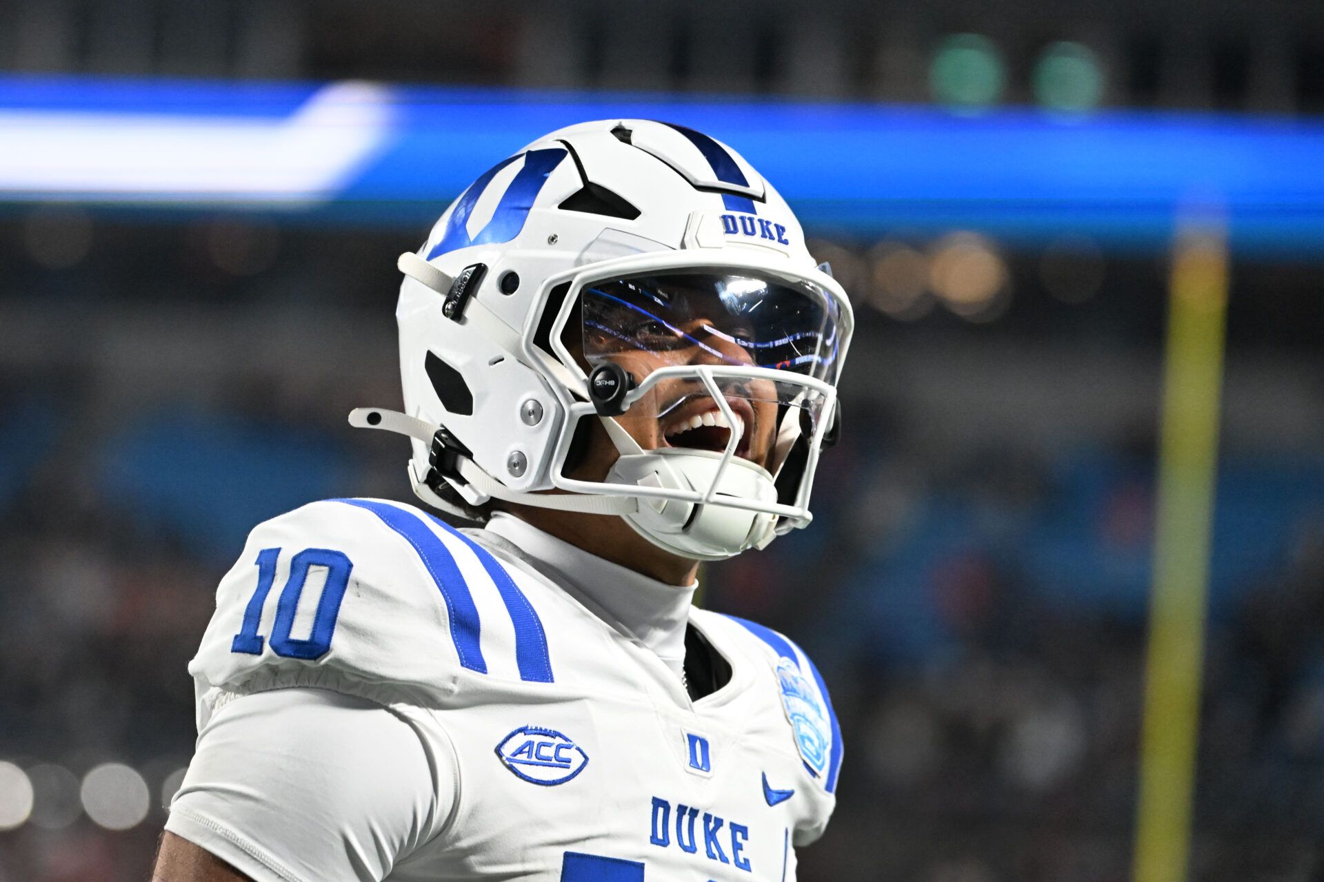 Duke Blue Devils quarterback Darian Mensah (10) celebrates after the Blue Devils score a touchdown in overtime during the  ACC Championship game at Bank of America Stadium.