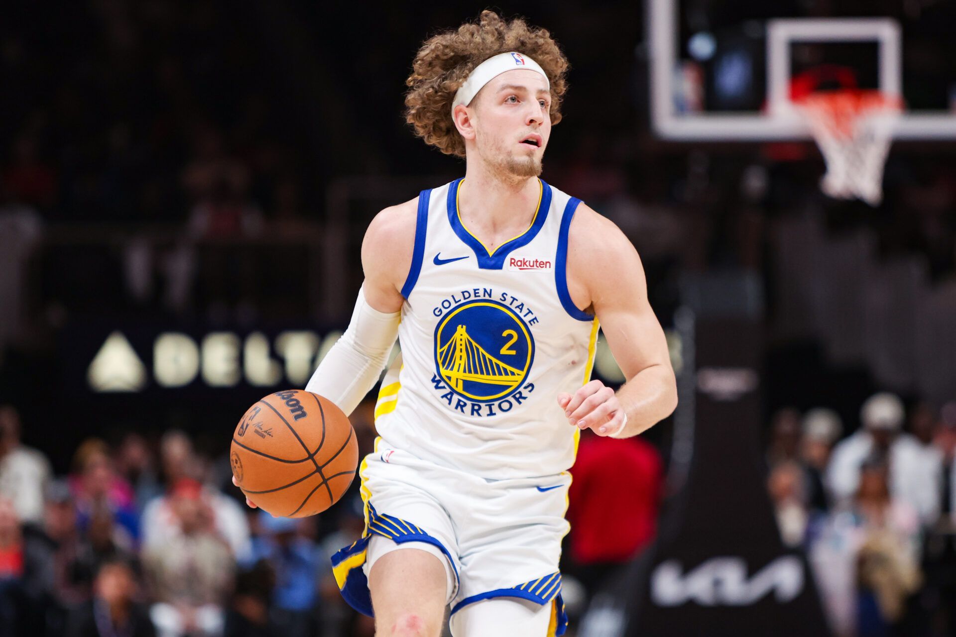 Golden State Warriors guard Brandin Podziemski (2) dribbles against the Atlanta Hawks in the third quarter at State Farm Arena.