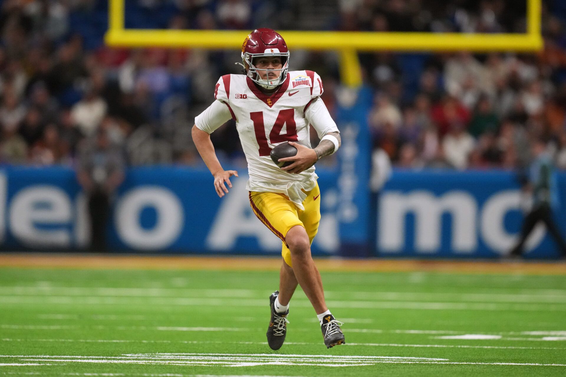 Southern California Trojans quarterback Jayden Maiava (14) carries the ball against the TCU Horned Frogs in the second half during the Alamo Bowl at Alamodome.