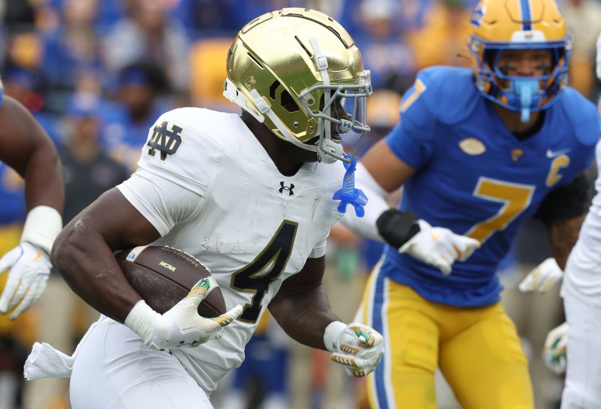 Notre Dame Fighting Irish running back Jeremiyah Love (4) runs the ball against the Pittsburgh Panthers during the second quarter at Acrisure Stadium.