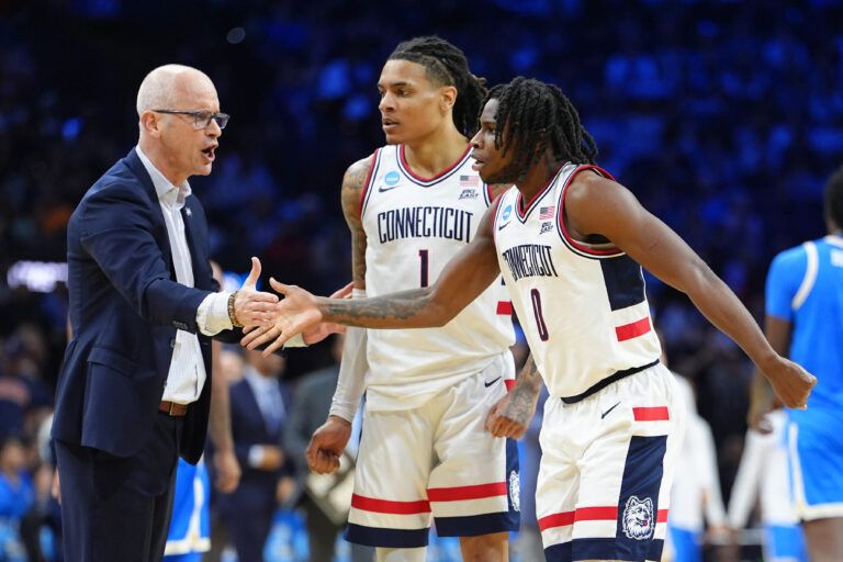 UConn Huskies guard Malachi Smith (0) reacts with head coach Dan Hurley in the first half during a second round game of the men's 2026 NCAA Tournament at Xfinity Mobile Arena.