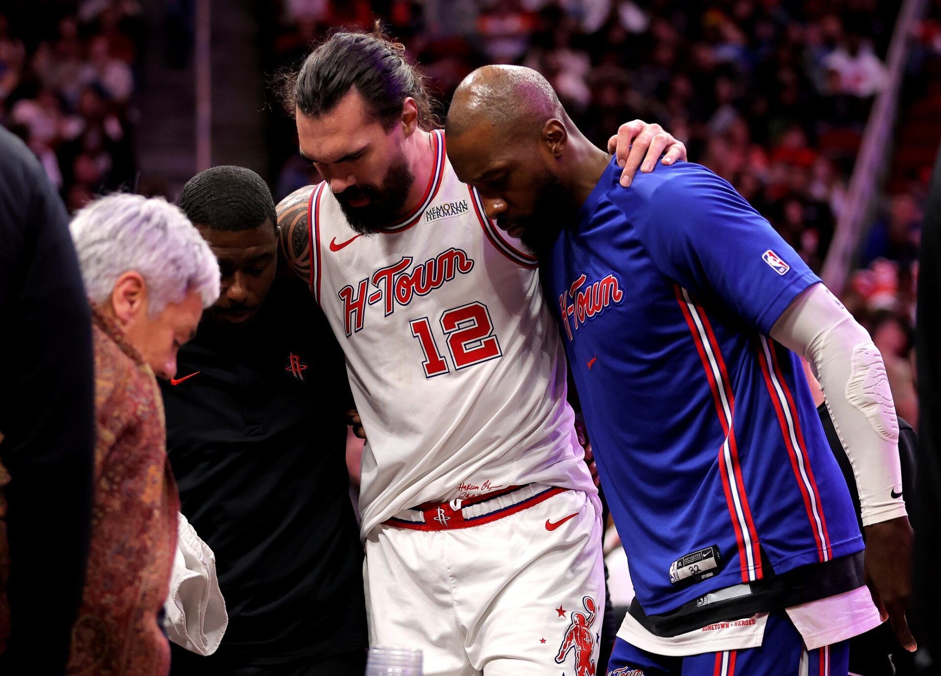 Houston Rockets center Steven Adams (12) is helped off the court after an injury against the New Orleans Pelicans during the fourth quarter at Toyota Center.