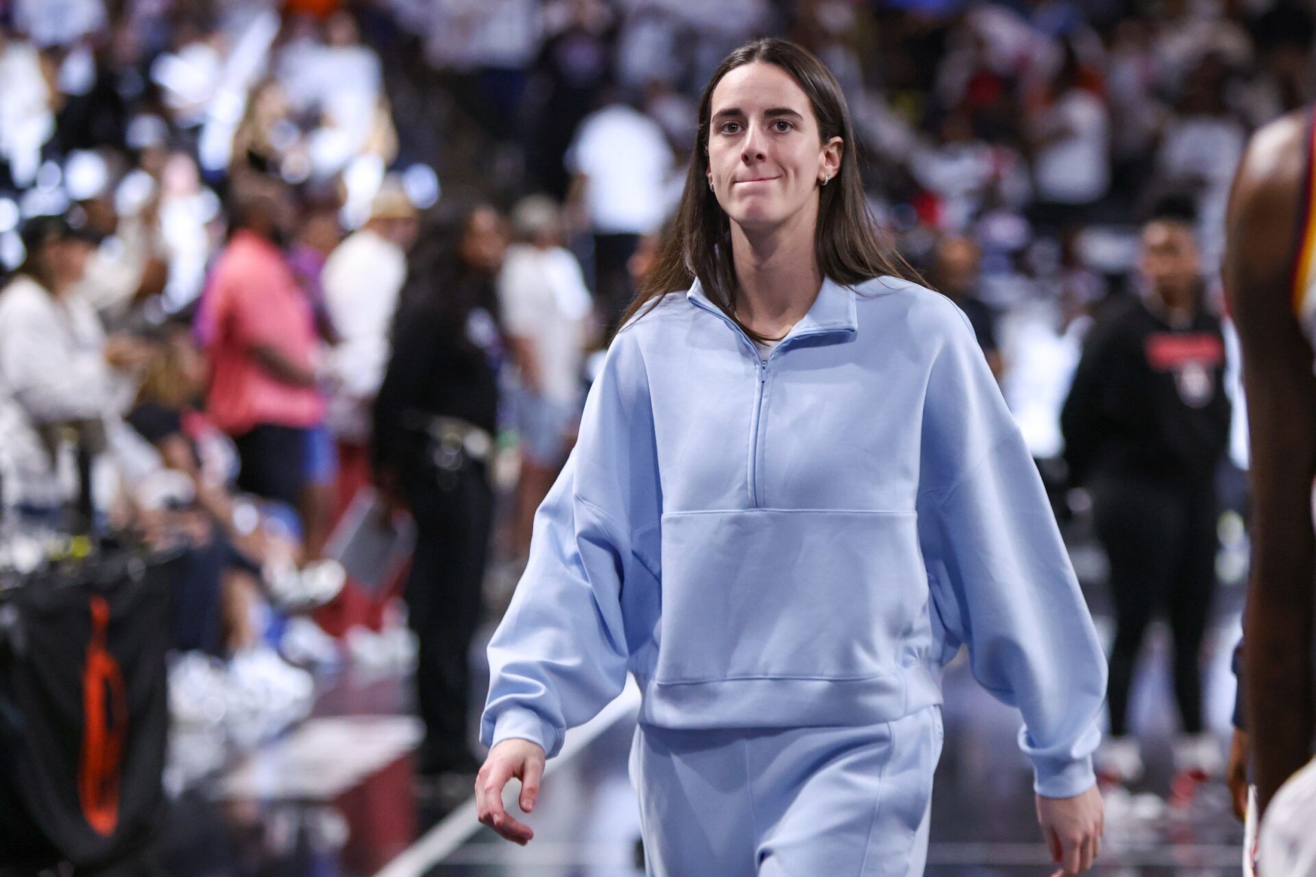 Indiana Fever guard Caitlin Clark (22) walks to the locker room against the Atlanta Dream at halftime during game one of round one for the 2025 WNBA Playoffs at Gateway Center Arena at College Park.