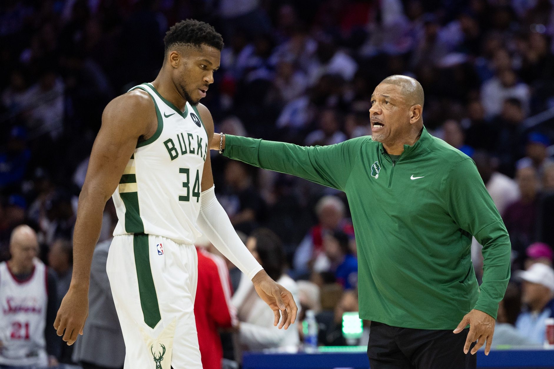 Milwaukee Bucks head coach Doc Rivers talks with forward Giannis Antetokounmpo (34) during the third quarter against the Philadelphia 76ers at Wells Fargo Center.