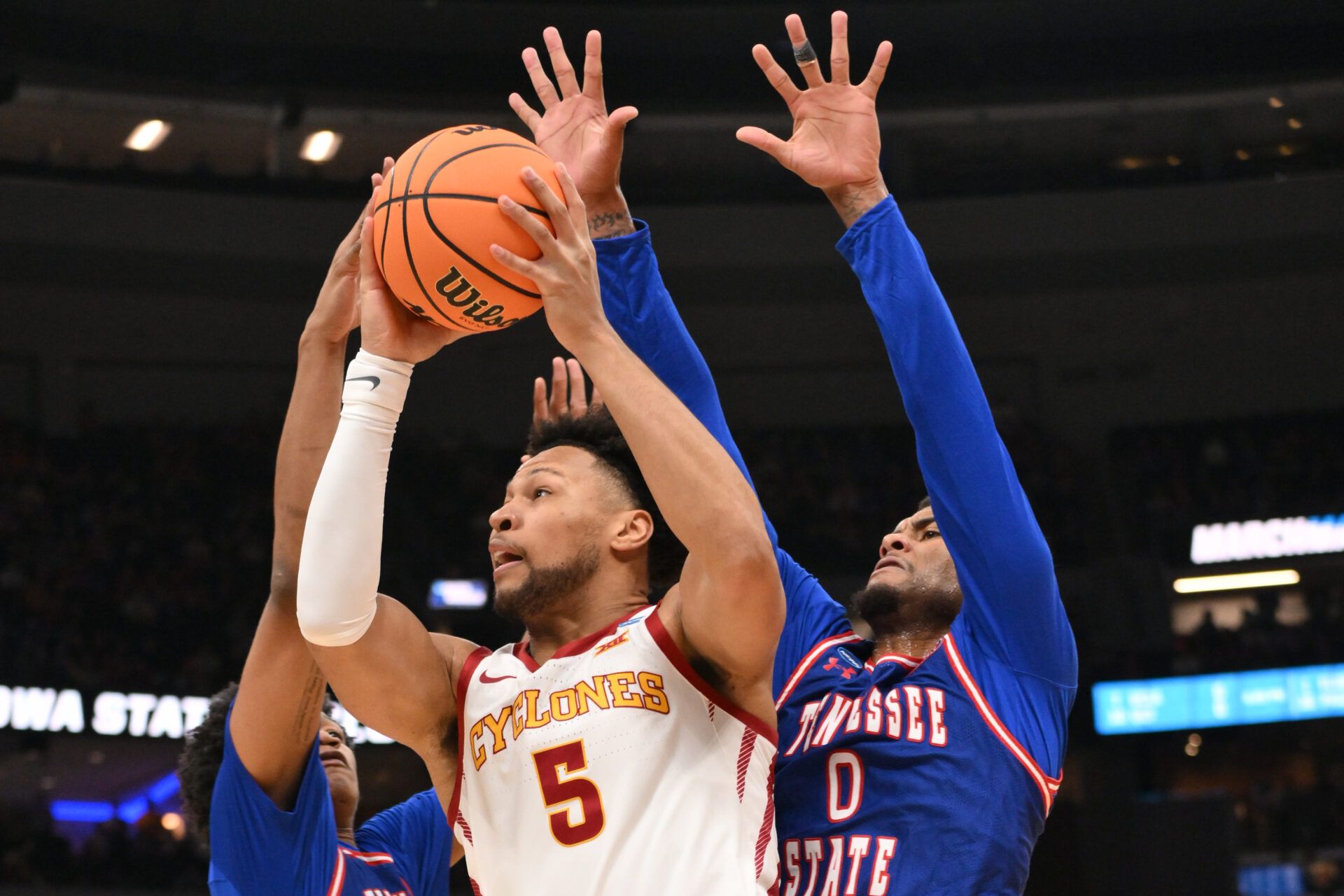 Iowa State Cyclones forward Joshua Jefferson (5) shoots a layup against Tennessee State Tigers forwards Antoine Lorick III (11) and Jalen Pitre (0) during the first half of a first round game of the men's 2026 NCAA Tournament at Enterprise Center.