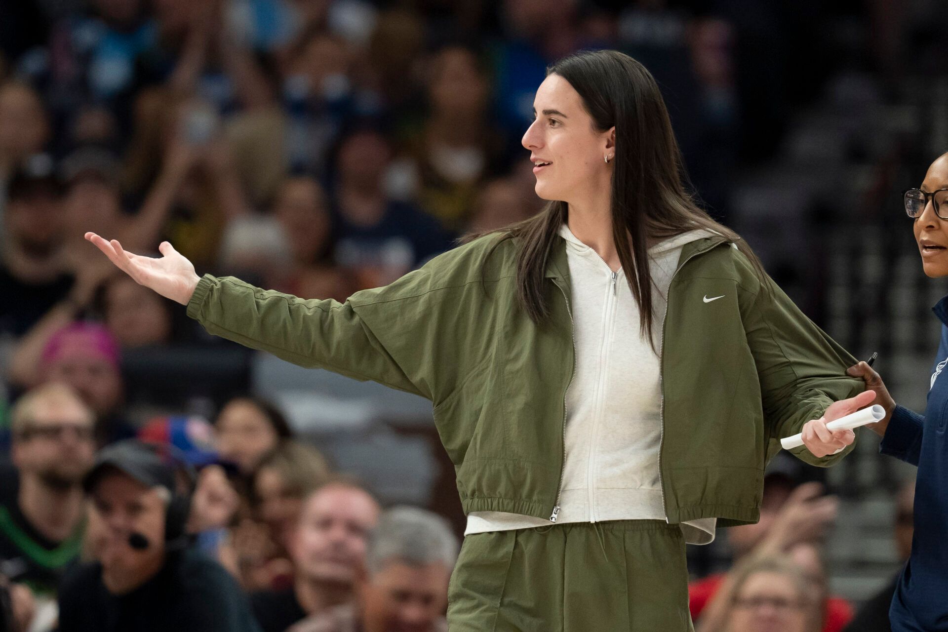 Indiana Fever guard Caitlin Clark (22) reacts from the bench to a foul called against the Minnesota Lynx in the first half at Target Center.
