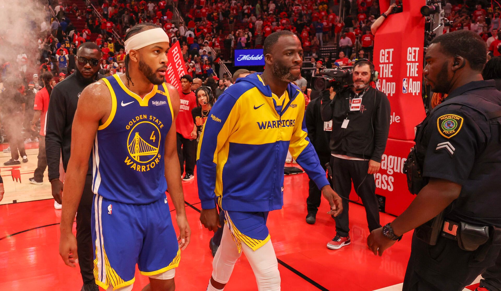 Golden State Warriors guard Moses Moody (4) and  forward Draymond Green (23) walks off the court after loosing to the Houston Rockets in game five of first round for the 2025 NBA Playoffs at Toyota Center.