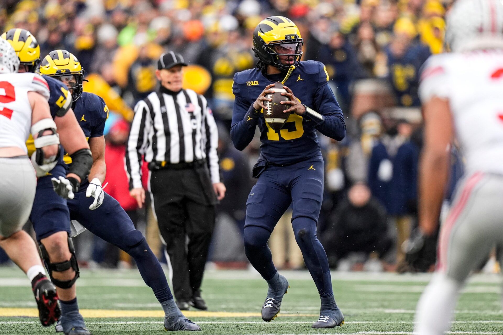 Michigan quarterback Bryce Underwood (19) looks to pass against Ohio State during the first half at Michigan Stadium in Ann Arbor on Saturday, Nov. 29, 2025.