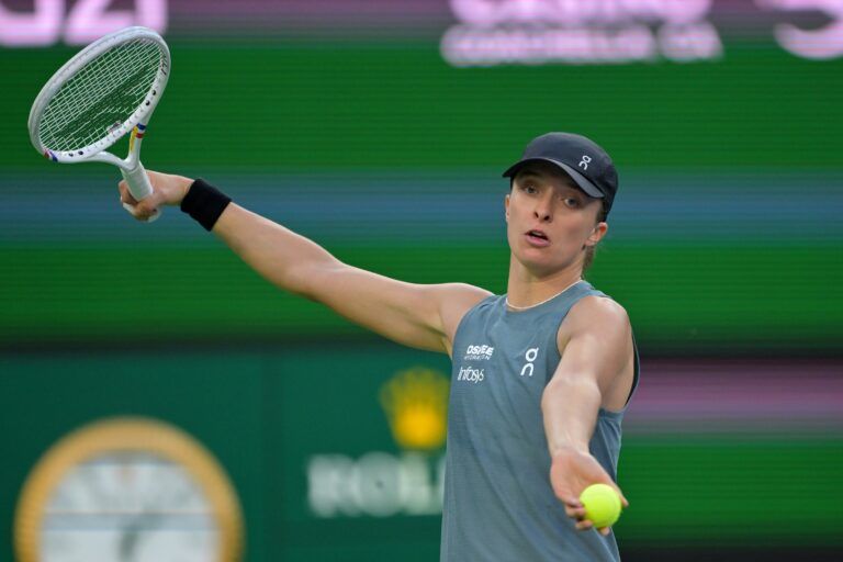 Iga Swiatek (POL) serves during her third round match against Maria Sakkari (GRE) in the BNP Paribas Open at the Indian Wells Tennis Garden.