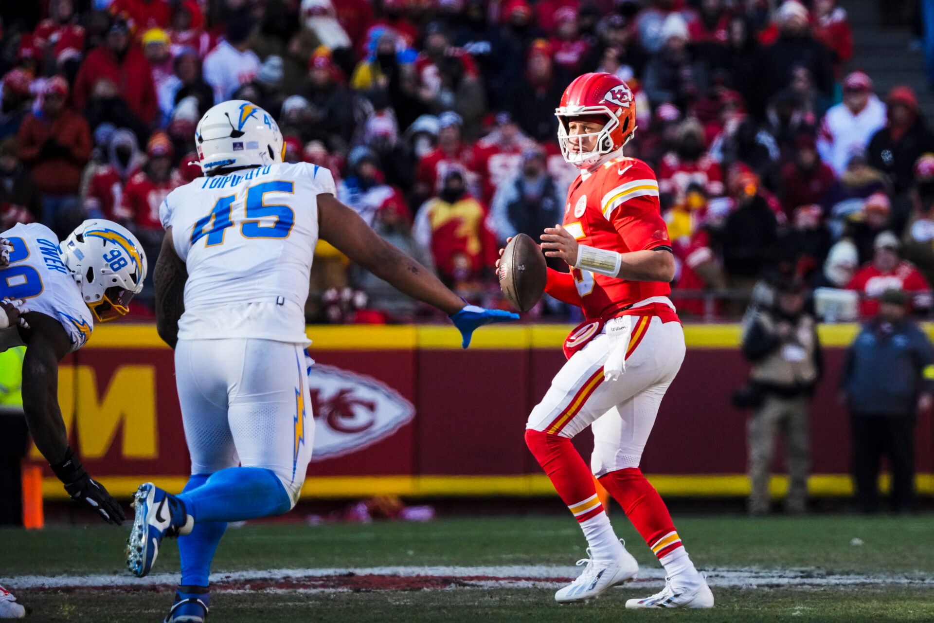 Kansas City Chiefs quarterback Patrick Mahomes (15) looks to pass against the Los Angeles Chargers during the second quarter at GEHA Field at Arrowhead Stadium.