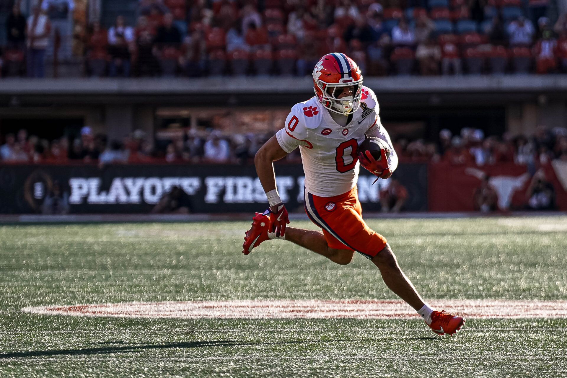 Clemson receiver Antonio Williams (0) runs the ball   against the Texas Longhorns in the first round of the College Football Playoffs at Darrell K Royal-Texas Memorial Stadium.