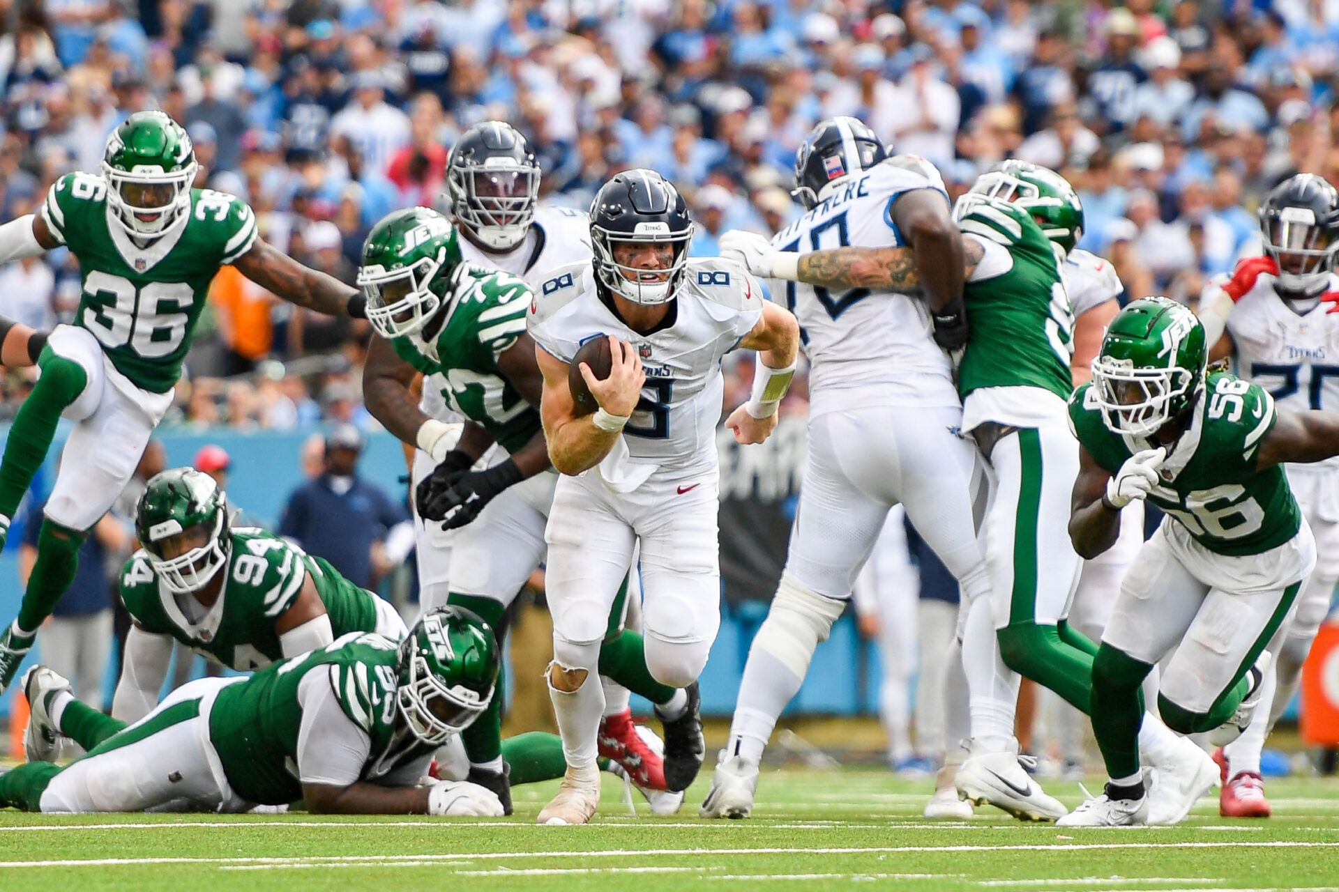 Tennessee Titans Will Levis (8) breaks the tackle of New York Jets defensive tackle Quinnen Williams (95) during the second half at Nissan Stadium.