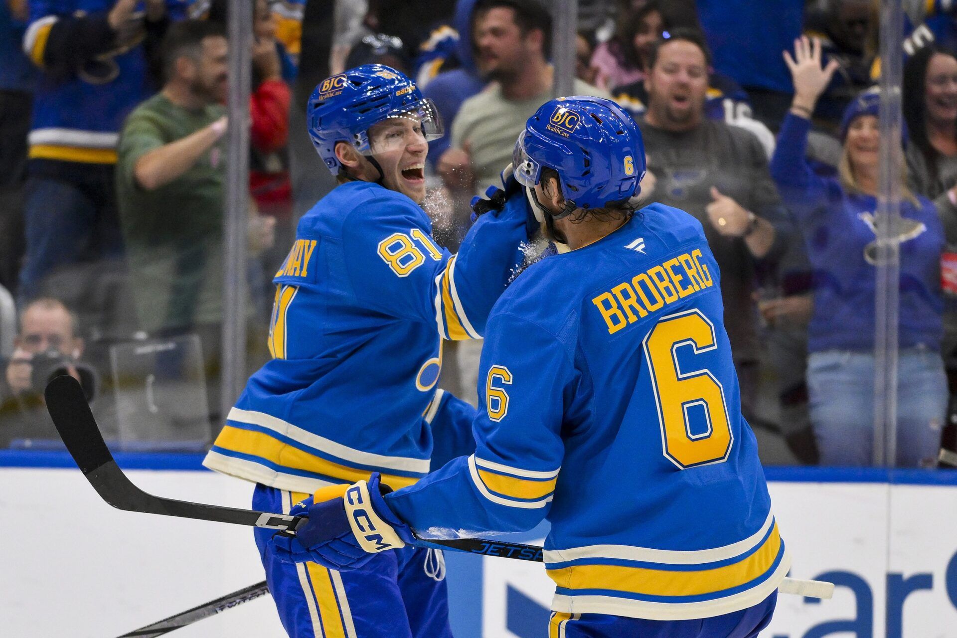 St. Louis Blues center Dylan Holloway (81) celebrates with defenseman Philip Broberg (6) after scoring against the Carolina Hurricanes during the second period at Enterprise Center.