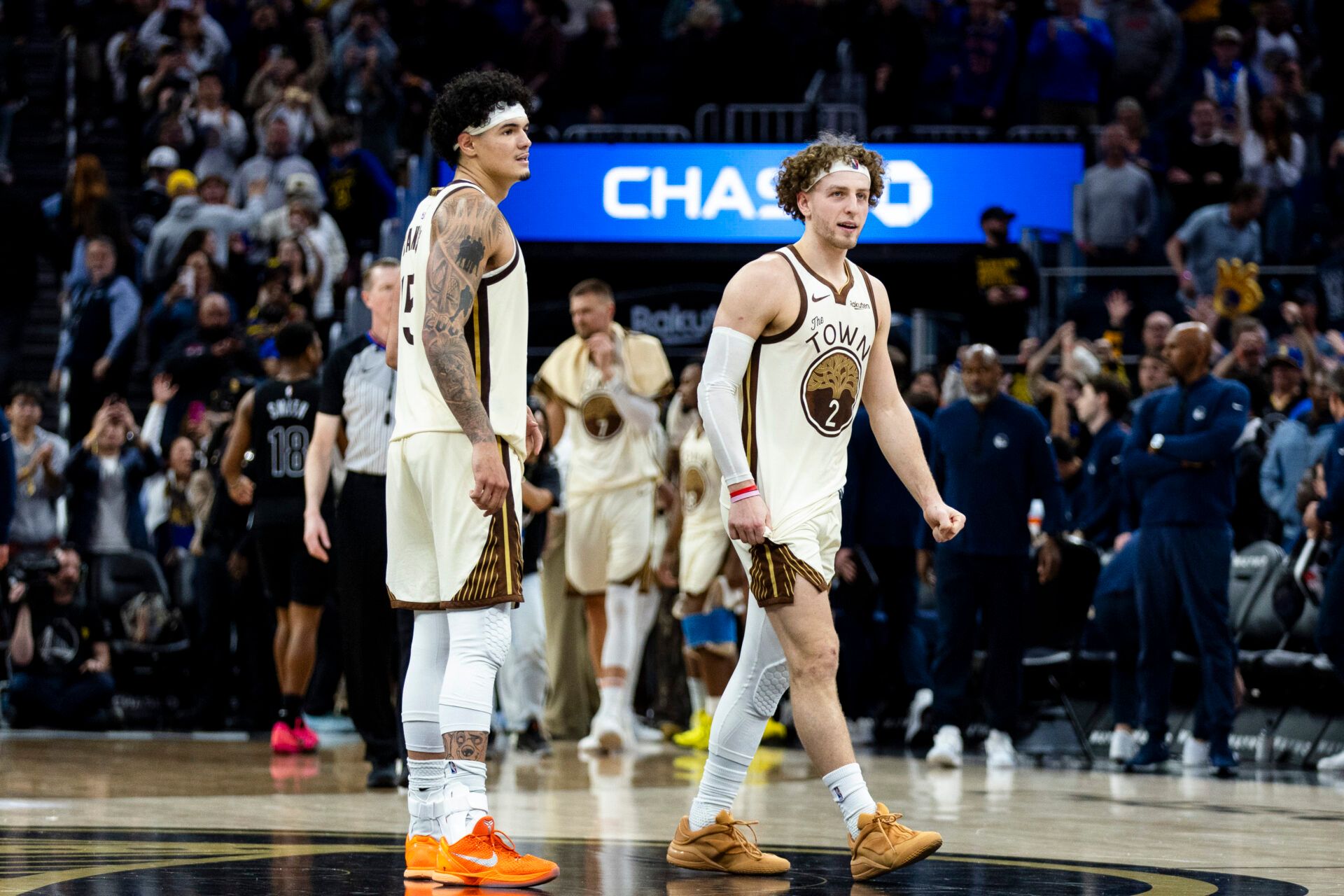 Golden State Warriors guard Brandin Podziemski (2) and forward Gui Santos (15) celebrate after their team defeated the Brooklyn Nets at Chase Center.