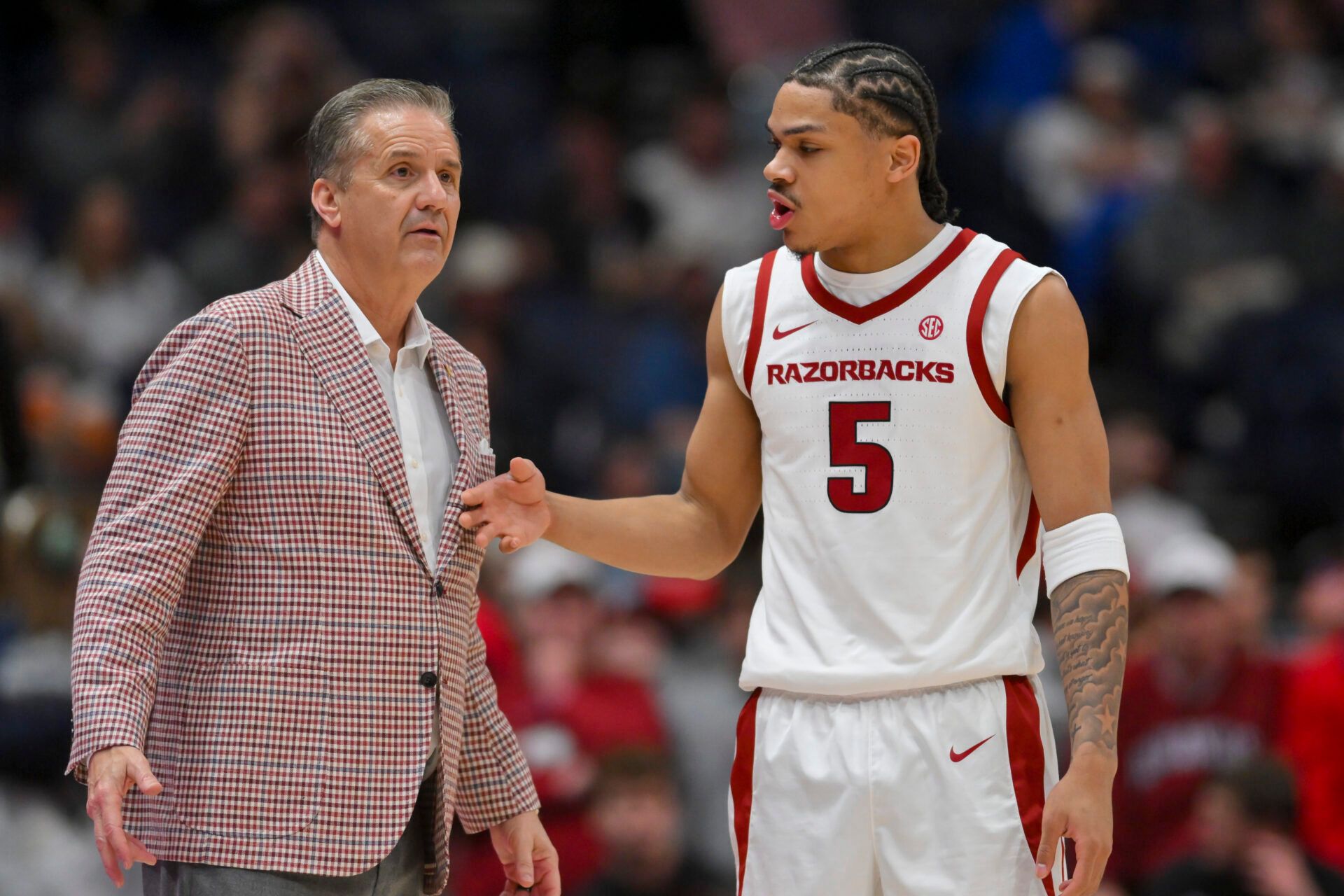 Arkansas Razorbacks head coach John Calipari talks with guard Darius Acuff Jr. (5) during a time out against the Oklahoma Sooners during the first half at Bridgestone Arena.