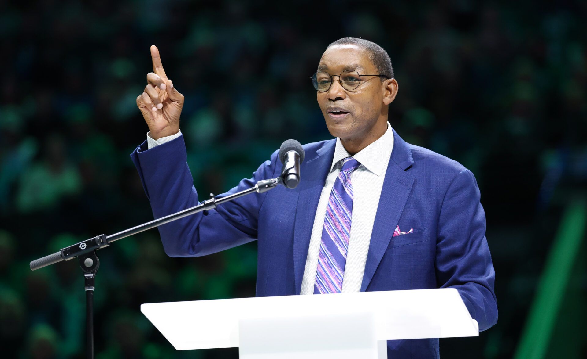 Detroit Pistons former player Isiah Thomas speaks at the retirement ceremony of Dallas Mavericks former player Mark Aguirre at halftime of teh game against the Charlotte Hornets at American Airlines Center.