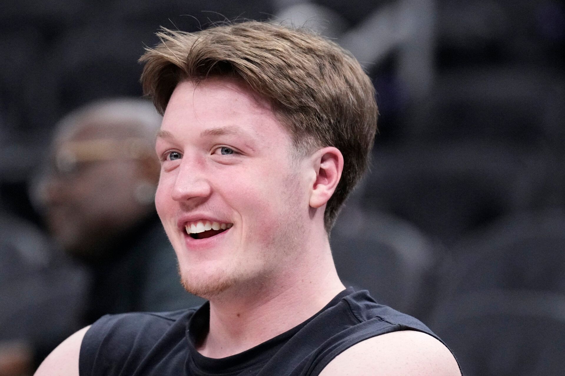 Charlotte Hornets guard Kon Knueppel (7) watching his teammates warm up before a game against the Milwaukee Bucks at Fiserv Forum.