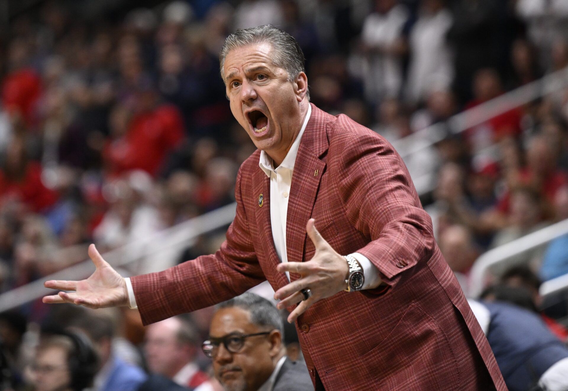 Arkansas Razorbacks head coach John Calipari reacts after a play against the Arizona Wildcats in the second half during a Sweet Sixteen game of the West Regional of the men's 2026 NCAA Tournament at SAP Center.