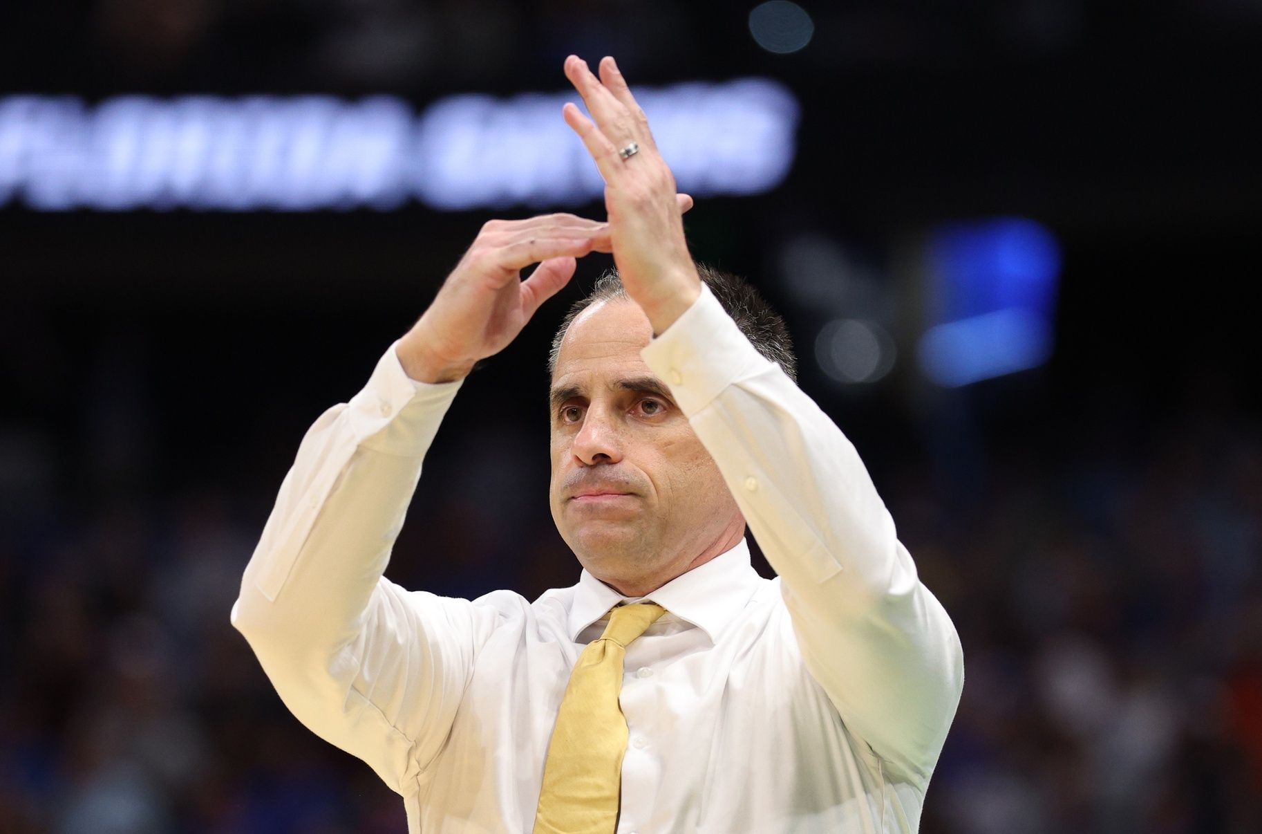 Iowa Hawkeyes head coach Ben McCollum calls a timeout against the Florida Gators in the second half during a second round game of the men's 2026 NCAA Tournament at Benchmark International Arena.