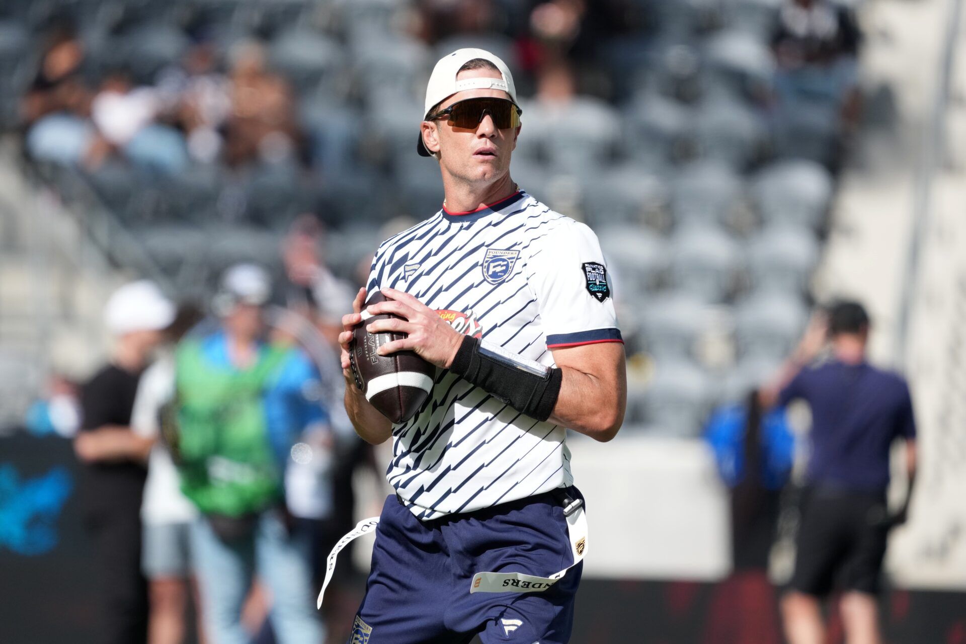 Founders FFC quarterback Tom Brady (12) throws ball during the Fanatics Flag Football Classic at BMO stadium.