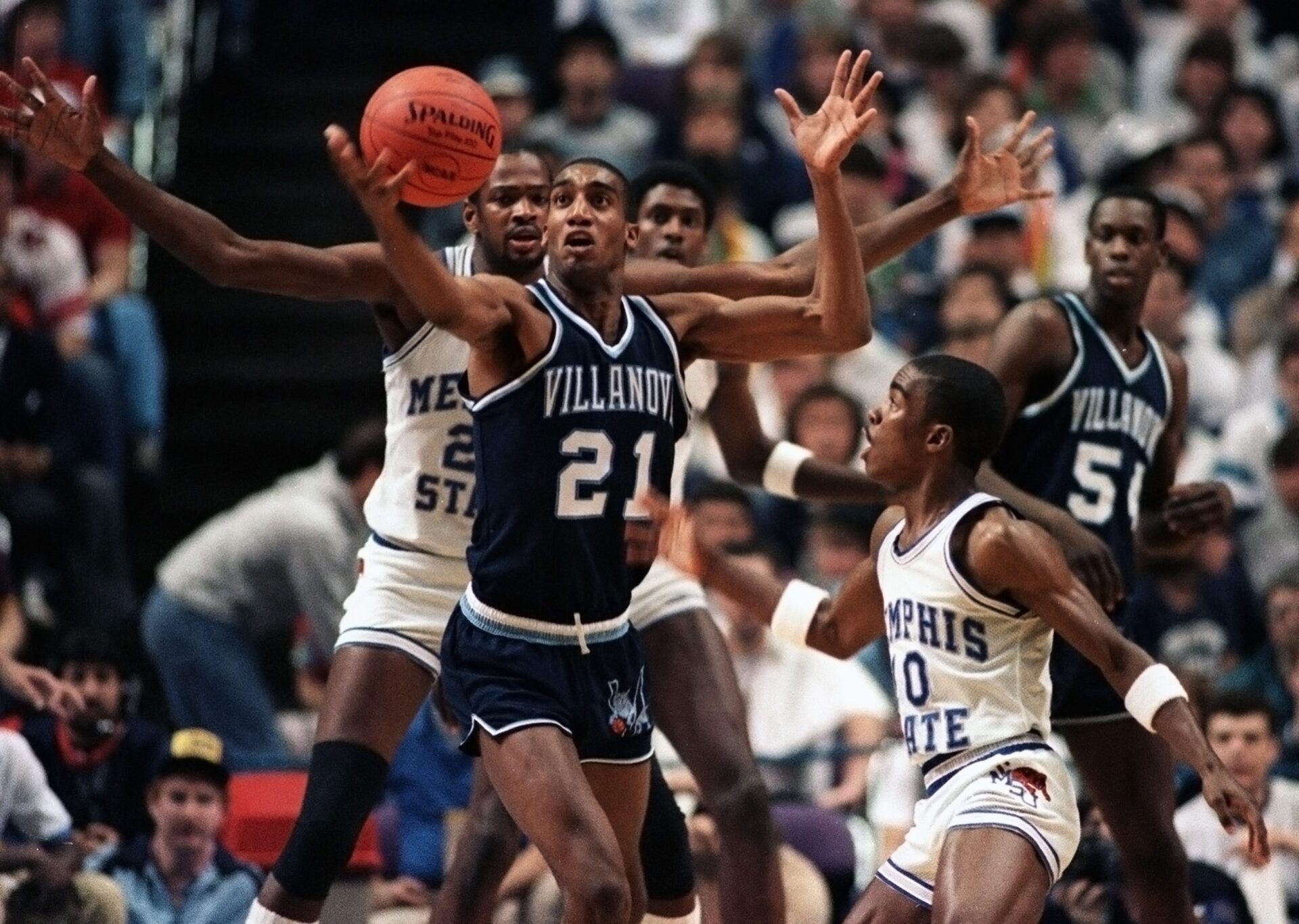 Memphis State's Keith Lee, William Bedford and Andre Turner surround Villanova's Harold Pressley (21) during Final Four action in Lexington, Kentucky, on March 30, 1985. Villanova's Ed Pinckney looks on at right.