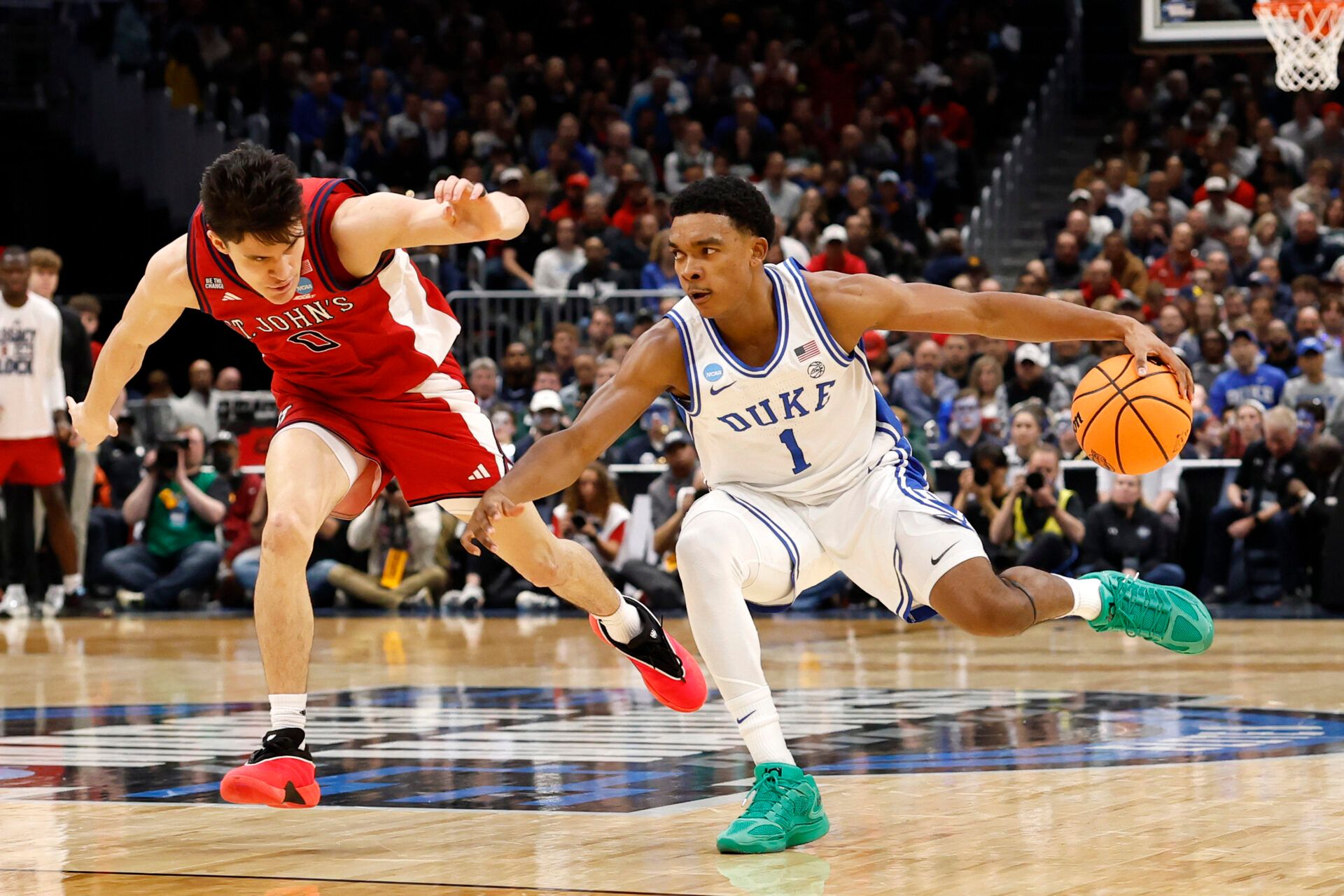 Duke Blue Devils guard Caleb Foster (1) dribbles the ball against St. John's Red Storm guard Dylan Darling (0) in the first half during a Sweet Sixteen game of the East Regional of the men's 2026 NCAA Tournament at Capital One Arena.